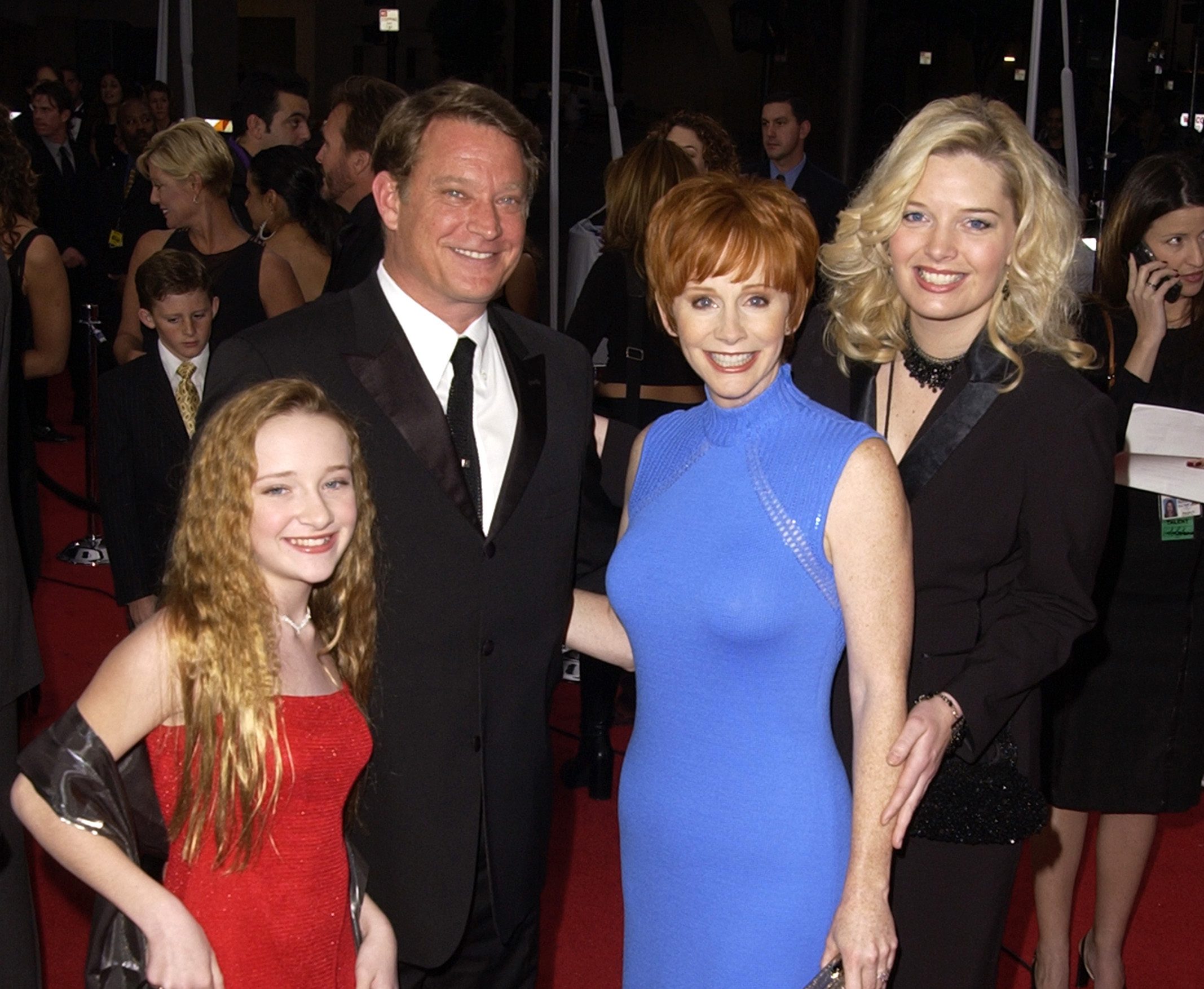 Scarlett Pomers, Reba McEntire, & Melissa Peterman from the show, Reba, arrive at the 28th Annual People's Choice Awards at the Pasadena Civic Auditorium in Pasadena, California.
