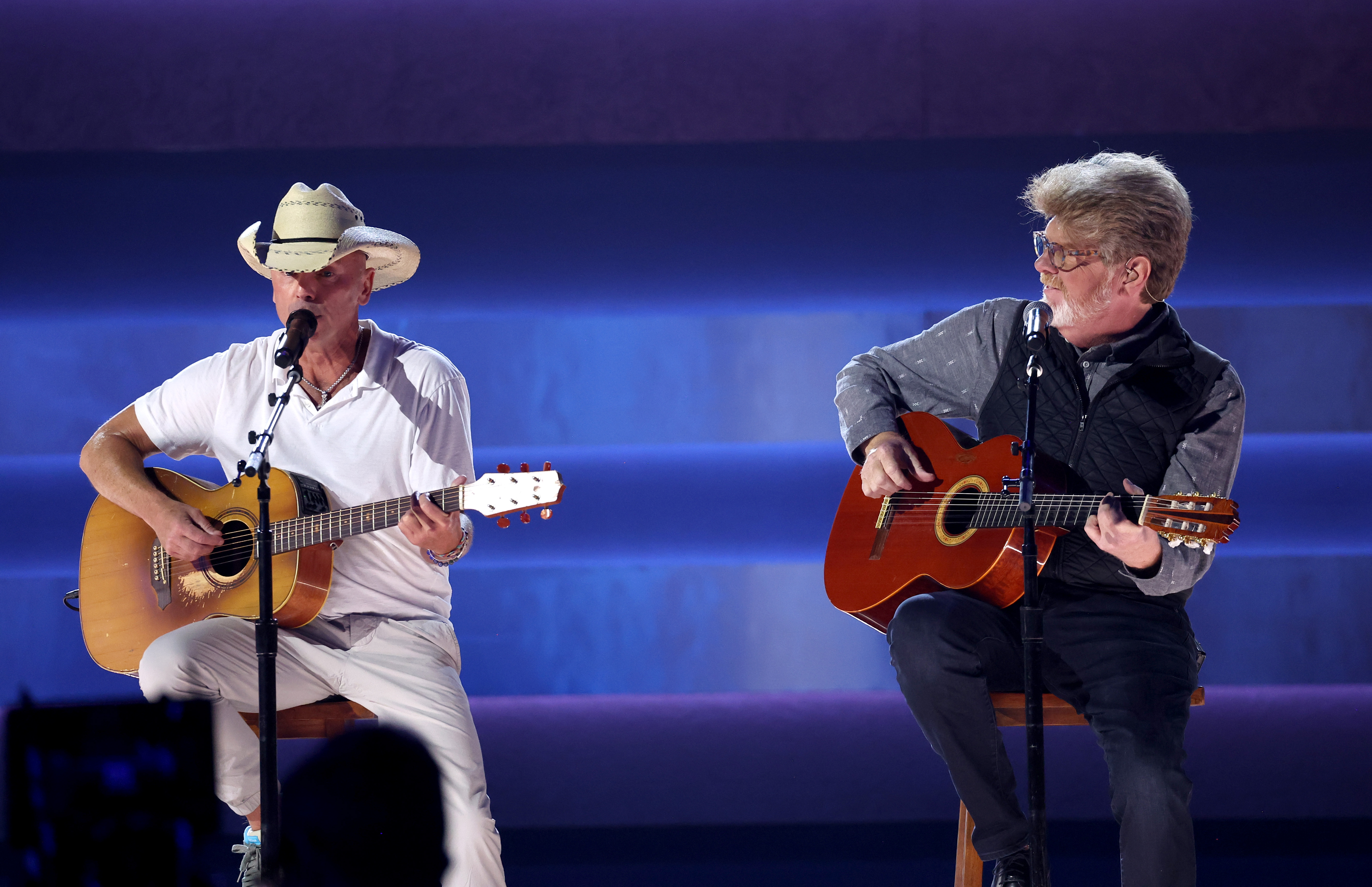 NASHVILLE, TENNESSEE - NOVEMBER 08: EDITORIAL USE ONLY (L-R) Kenny Chesney and Mac McAnally perform onstage during the 57th Annual CMA Awards at Bridgestone Arena on November 08, 2023 in Nashville, Tennessee.