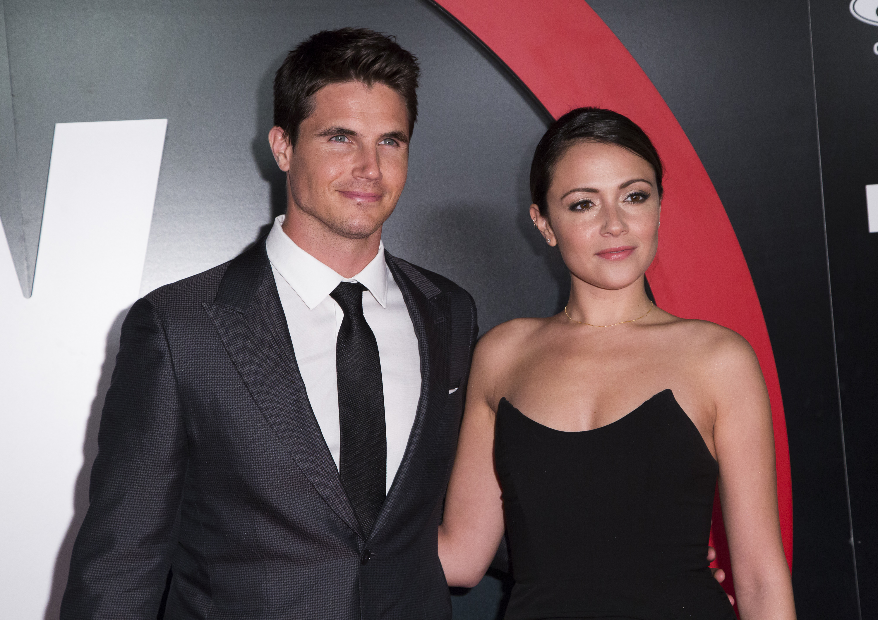 LOS ANGELES, CA - JANUARY 12: Actors Robbie Amell (L) and Italia Ricci attend the premiere of Fox's "The X-Files" at California Science Center on January 12, 2016 in Los Angeles, California.