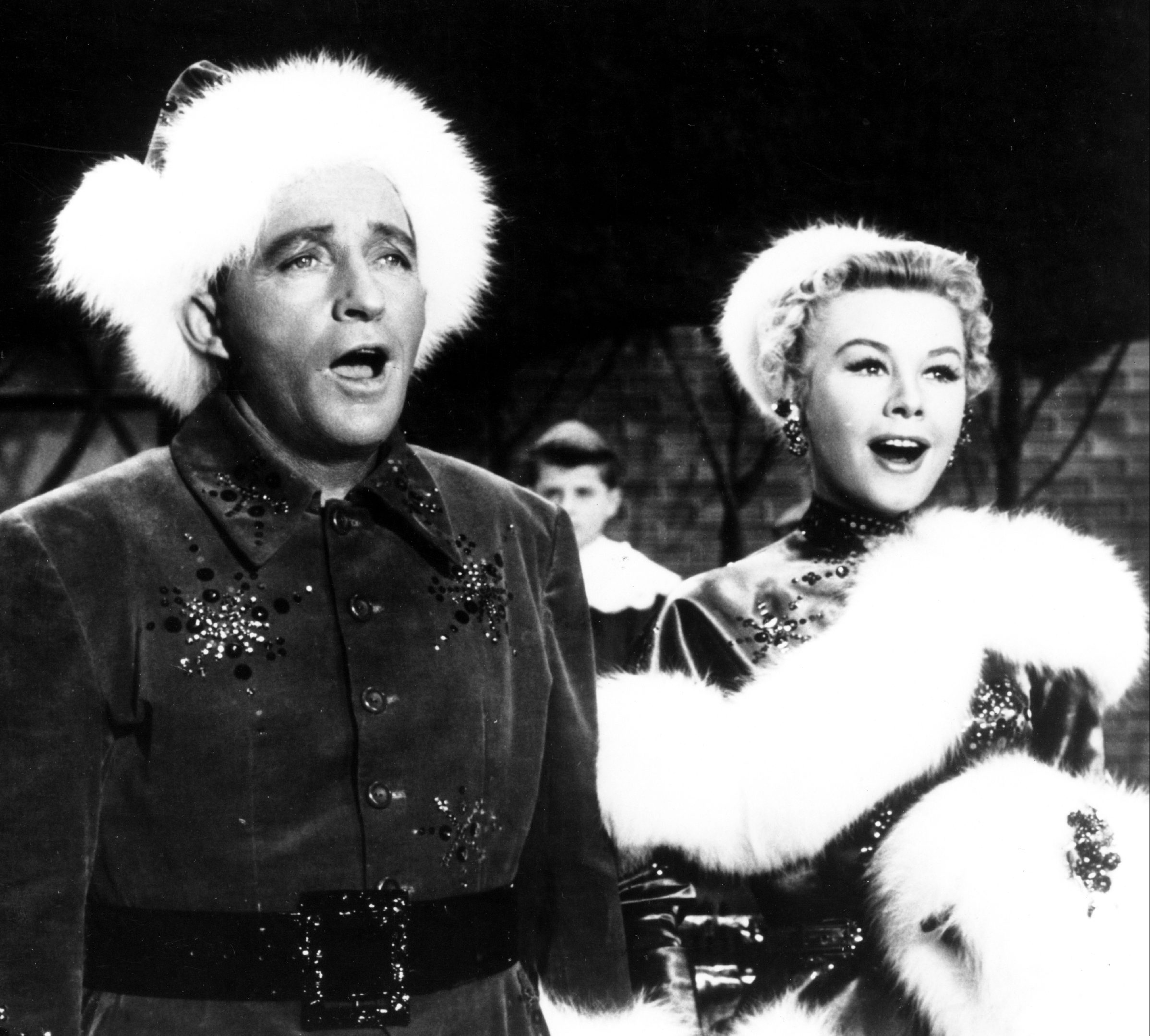 American singer and actor Bing Crosby (1903 - 1977) and American actress and dancer Vera-Ellen (1921 - 1981) in 'White Christmas', directed by Michael Curtiz, 1954. 
