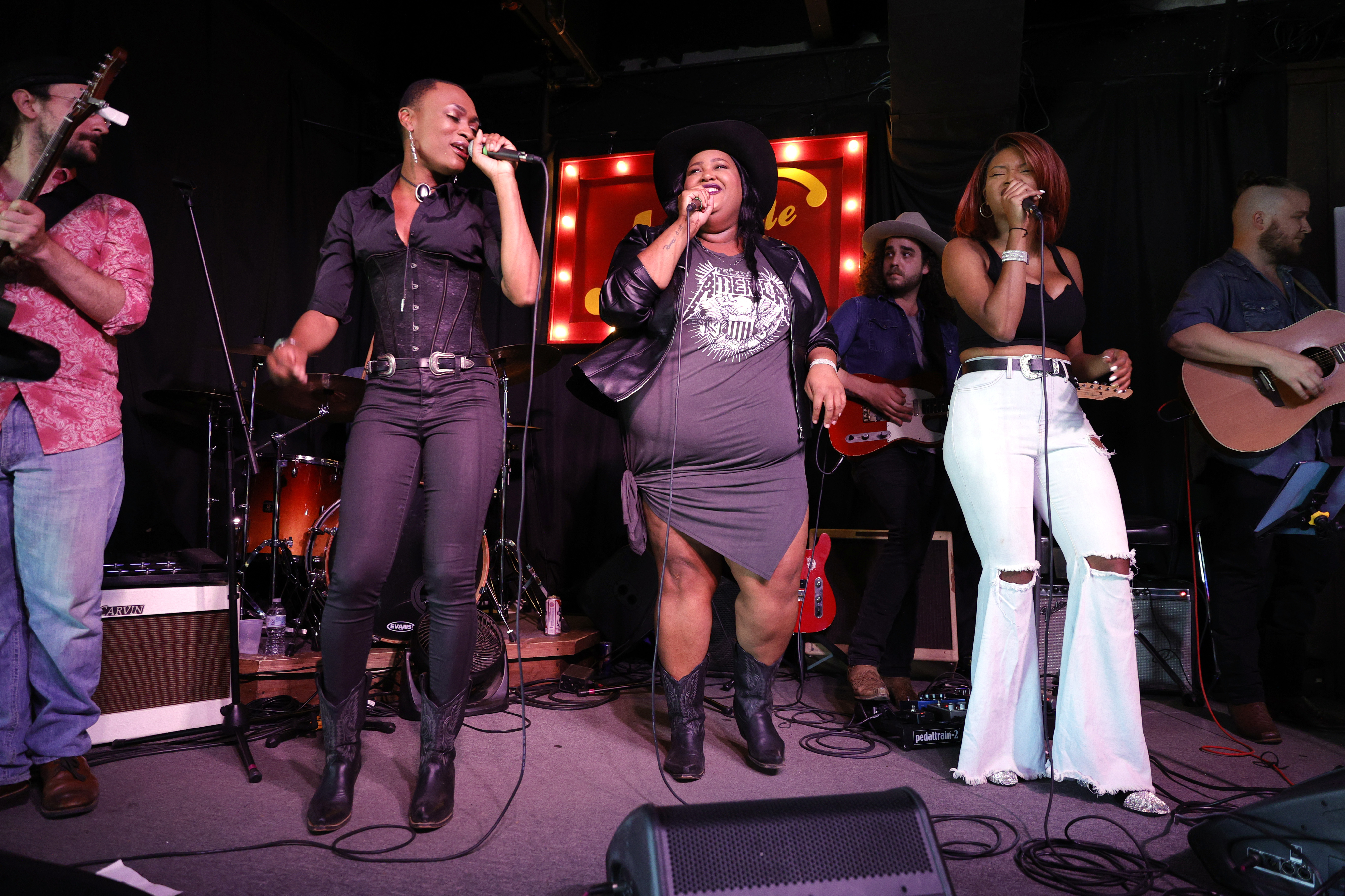NASHVILLE, TENNESSEE - APRIL 22: Trea Swindle, Danica Hart and Devynn Hart of the band Chapel Hart perform at the Nashville Palace on April 22, 2021 in Nashville, Tennessee. 