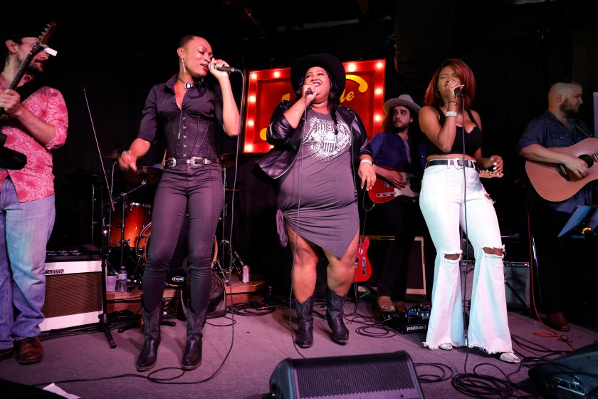 NASHVILLE, TENNESSEE - APRIL 22: Trea Swindle, Danica Hart and Devynn Hart of the band Chapel Hart perform at the Nashville Palace on April 22, 2021 in Nashville, Tennessee.