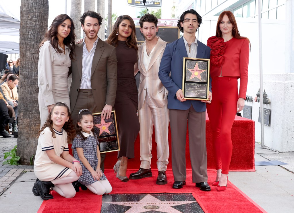 HOLLYWOOD, CALIFORNIA - JANUARY 30: (L-R) Danielle Jonas, Kevin Jonas, Priyanka Chopra, Nick Jonas, Joe Jonas, Sophie Turner, and (front) Alena Rose Jonas and Valentina Angelina Jonas attend The Hollywood Walk of Fame star ceremony honoring The Jonas Brothers on January 30, 2023 in Hollywood, California.