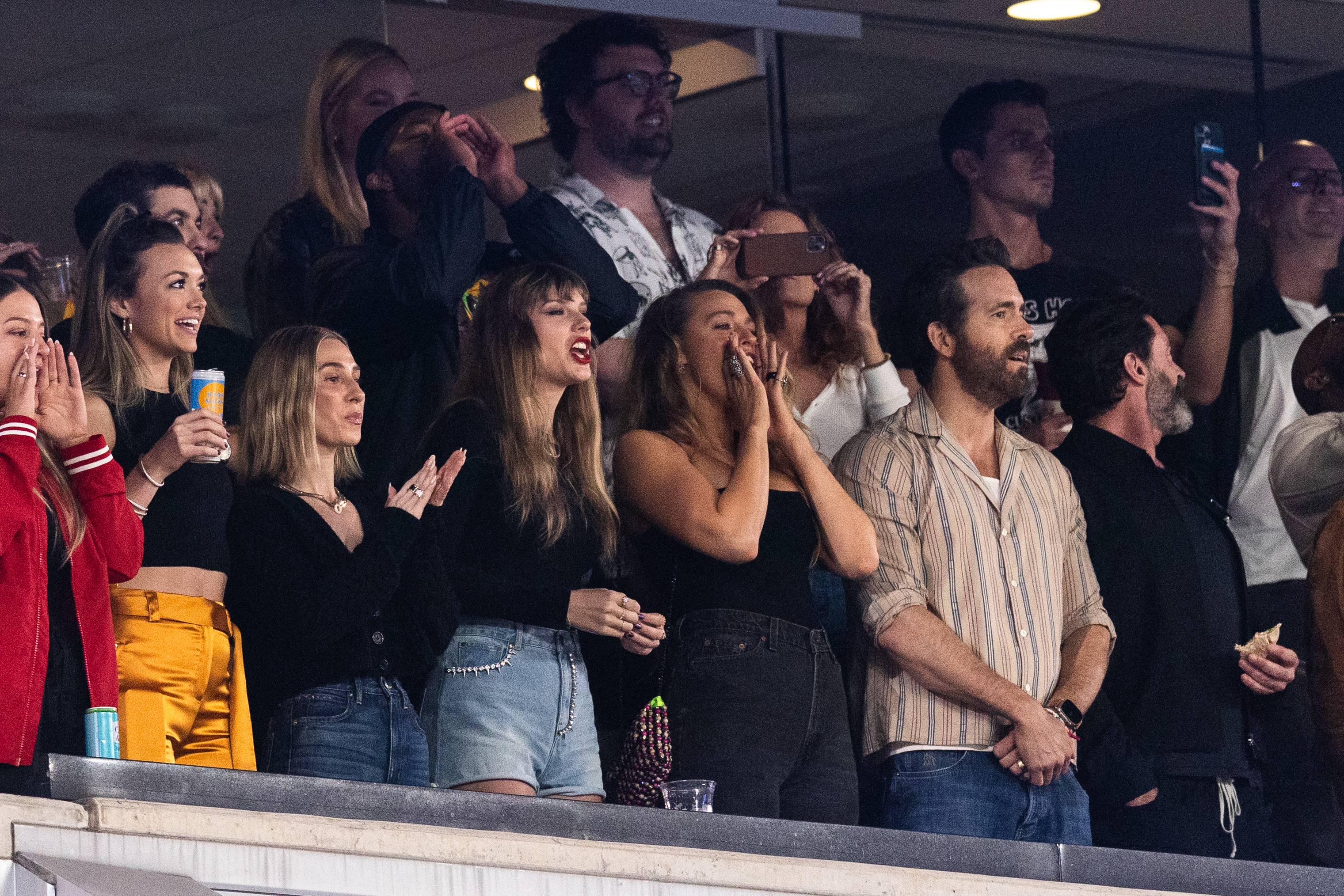EAST RUTHERFORD, NEW JERSEY - OCTOBER 01: (L-R) Singer Taylor Swift, Blake Lively, and Actor Ryan Reynolds look on prior to the game between the Kansas City Chiefs and the New York Jets at MetLife Stadium on October 01, 2023 in East Rutherford, New Jersey.
