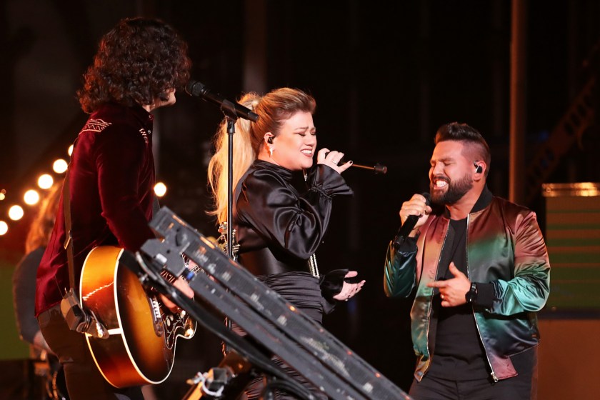 LAS VEGAS, NEVADA - APRIL 07: Kelly Clarkson (C) performs with Dan Smyers (L) and Shay Mooney (R) of Dan + Shay onstage during the 54th Academy Of Country Music Awards at MGM Grand Garden Arena on April 07, 2019 in Las Vegas, Nevada.