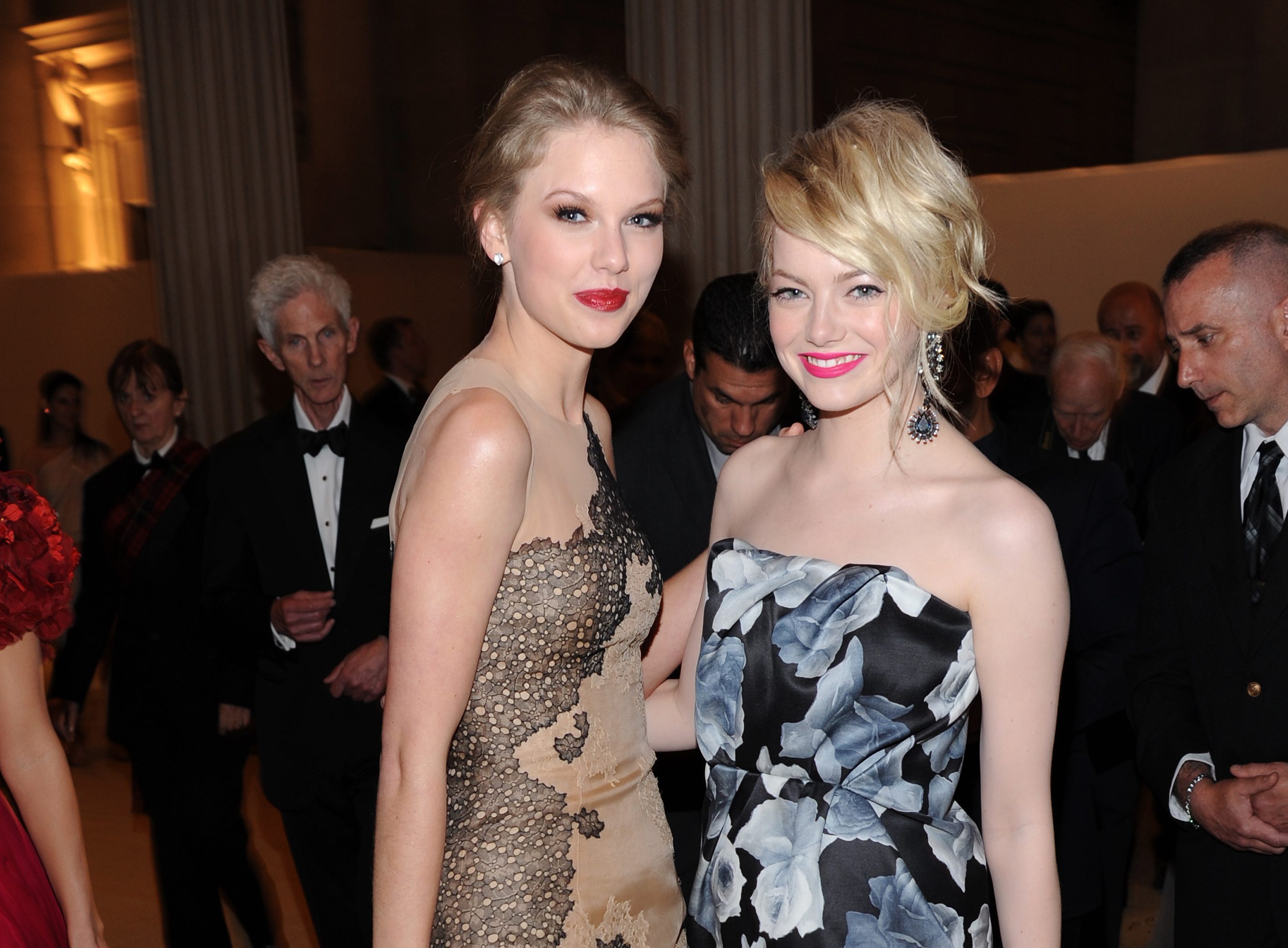Taylor Swift (L) and Emma Stone attend the Metropolitan Museum of Art's 2011 Costume Institute Gala featuring the opening of the exhibit Alexander McQueen : Savage Beauty. Swift wears J. Mendel and Stone wears Lanvin. 