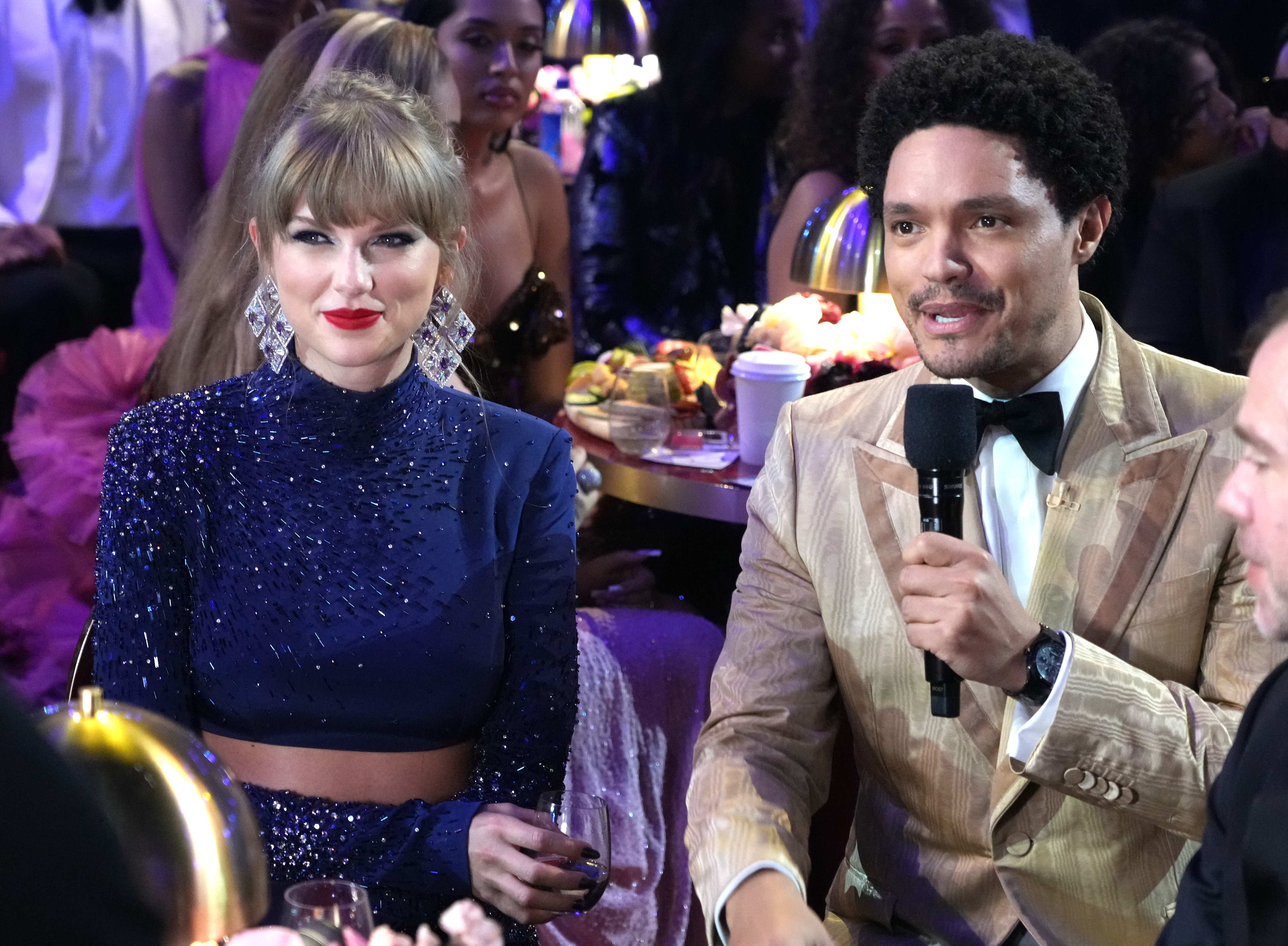LOS ANGELES, CALIFORNIA - FEBRUARY 05: (L-R) Taylor Swift and host Trevor Noah speak during the 65th GRAMMY Awards at Crypto.com Arena on February 05, 2023 in Los Angeles, California.
