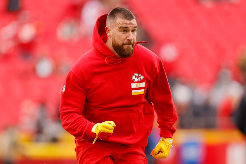 KANSAS CITY, MISSOURI - DECEMBER 31: Travis Kelce #87 of the Kansas City Chiefs warms up before the game against the Cincinnati Bengals at GEHA Field at Arrowhead Stadium on December 31, 2023 in Kansas City, Missouri.