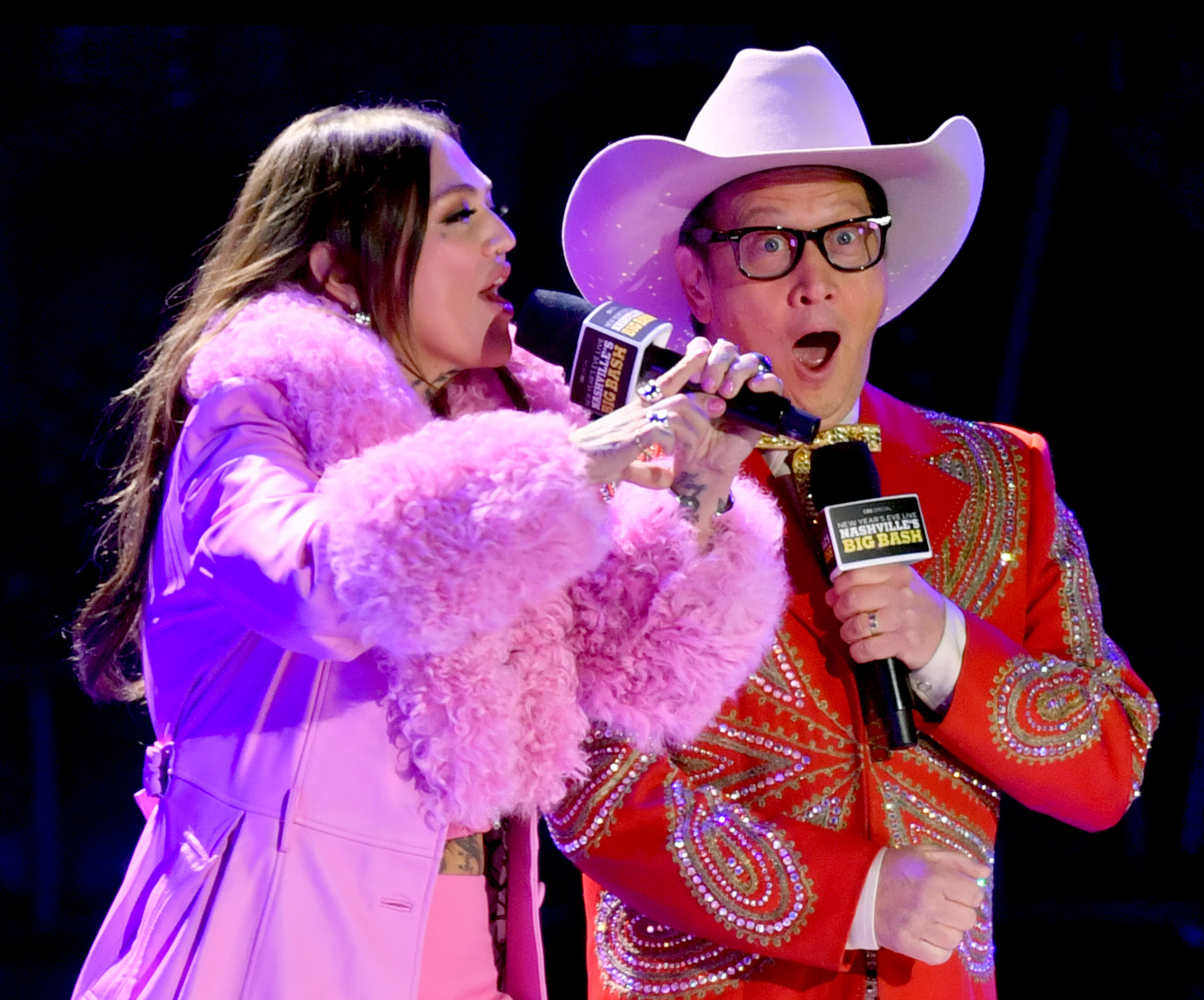 NASHVILLE, TENNESSEE - DECEMBER 31: (L-R) Elle King and Rob Schneider speak onstage for New Year's Eve Live: Nashville's Big Bash at Bicentennial Capitol Mall State Park on December 31, 2023 in Nashville, Tennessee.