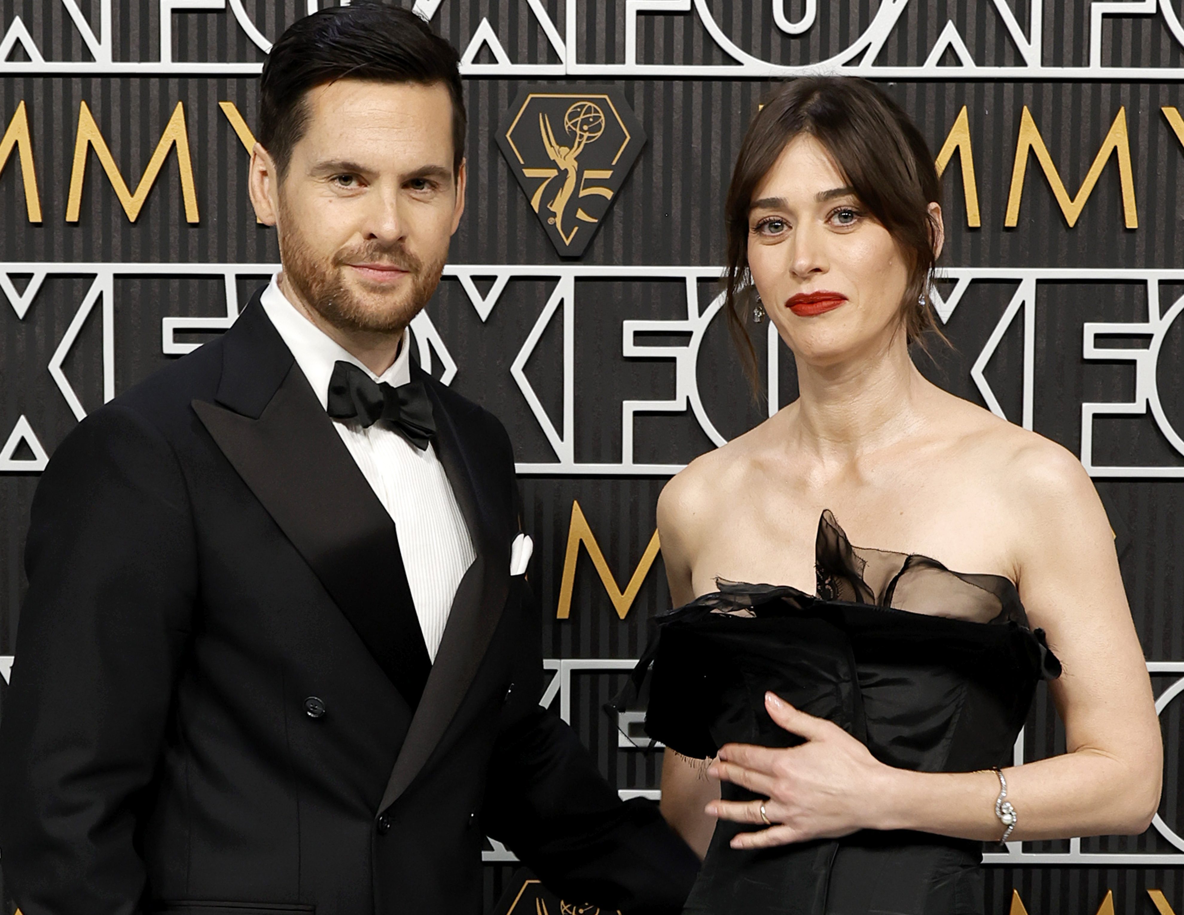 LOS ANGELES, CALIFORNIA - JANUARY 15: (L-R) Tom Riley and Lizzy Caplan attend the 75th Primetime Emmy Awards at Peacock Theater on January 15, 2024 in Los Angeles, California. 