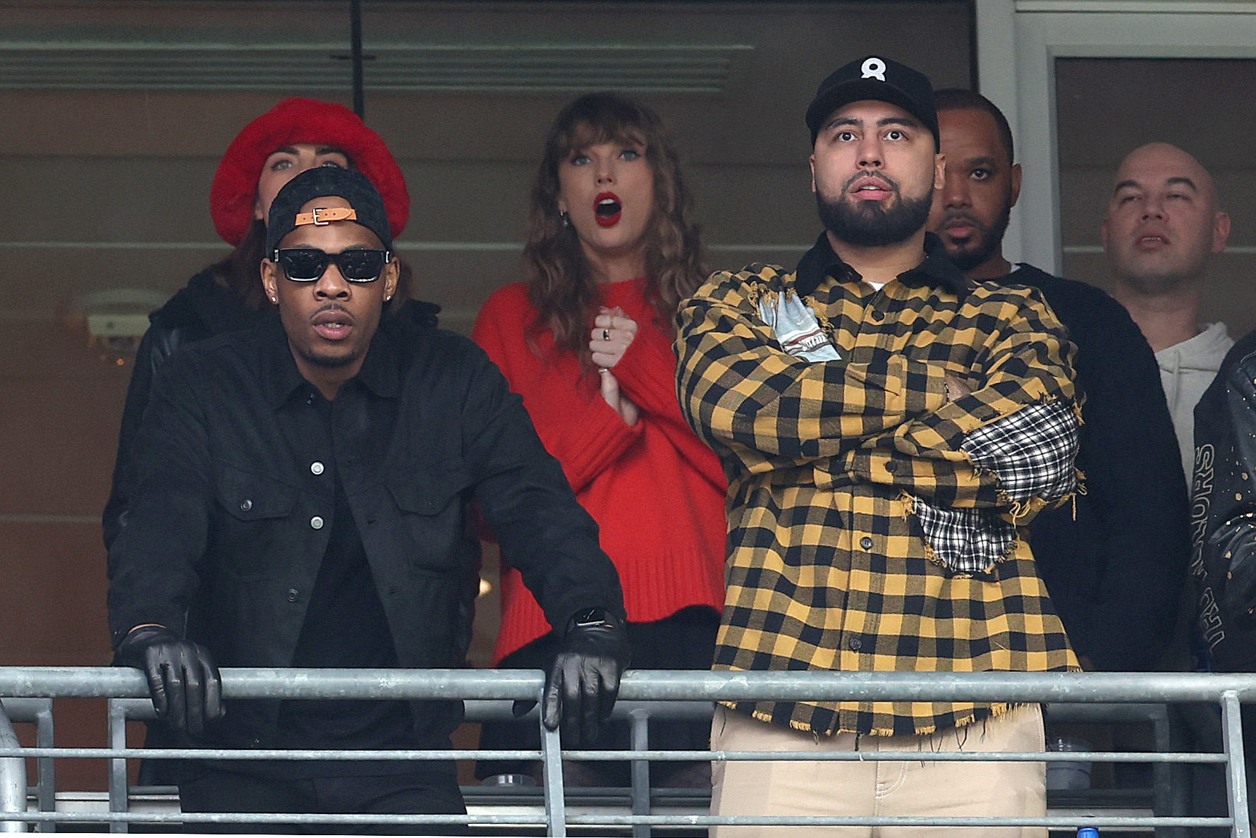 BALTIMORE, MARYLAND - JANUARY 28: Taylor Swift and Ross Travis look on during the second quarter in the AFC Championship Game between the Baltimore Ravens and the Kansas City Chiefs at M&T Bank Stadium on January 28, 2024 in Baltimore, Maryland.