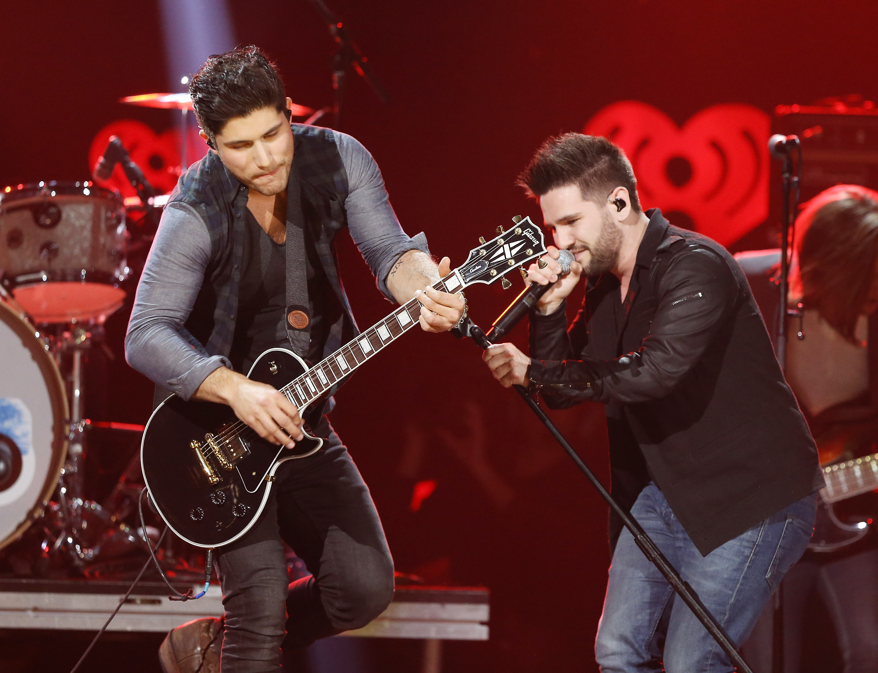 AUSTIN, TX - MARCH 29: Dan Smyers (L) and Shay Mooney of Dan + Shay perform onstage during the iHeartRadio Country Festival at the Frank Erwin Center on March 29, 2014 in Austin, Texas.