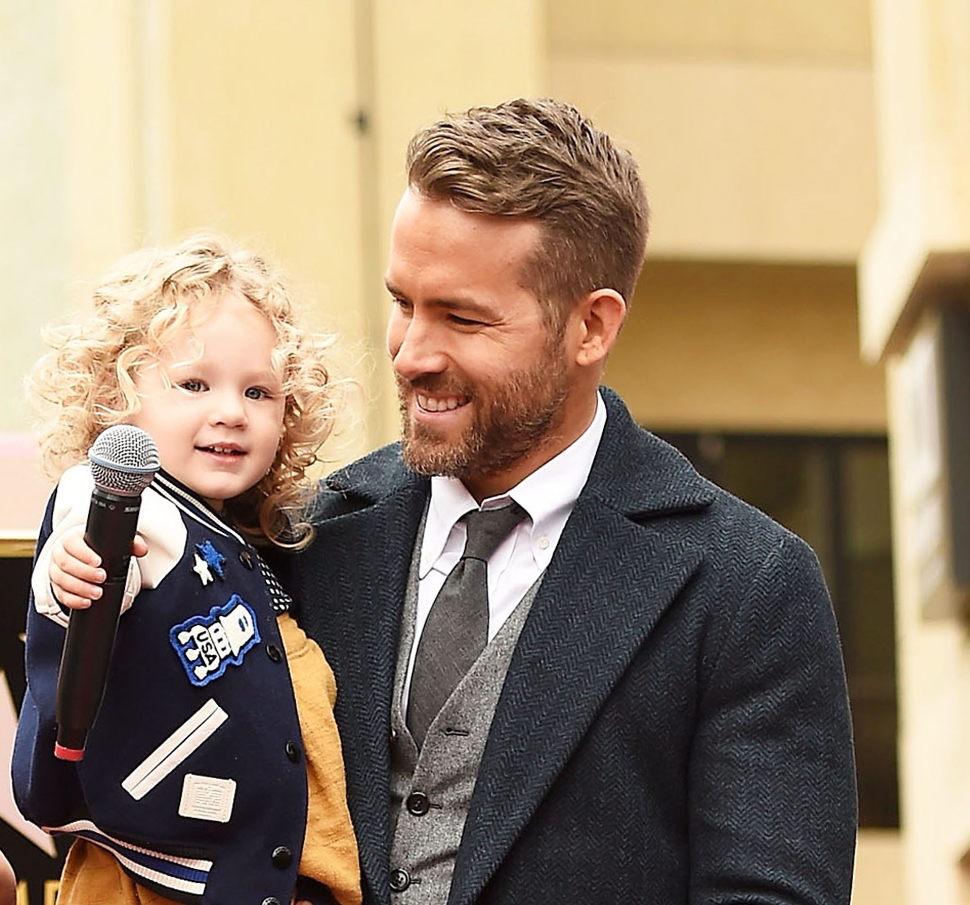 HOLLYWOOD, CA - DECEMBER 15: Actor Ryan Reynolds (R) poses for a photo with his daughter, James Reynolds during a ceremony honoring him with a star on the Hollywood Walk of Fame on December 15, 2016 in Hollywood, California. 