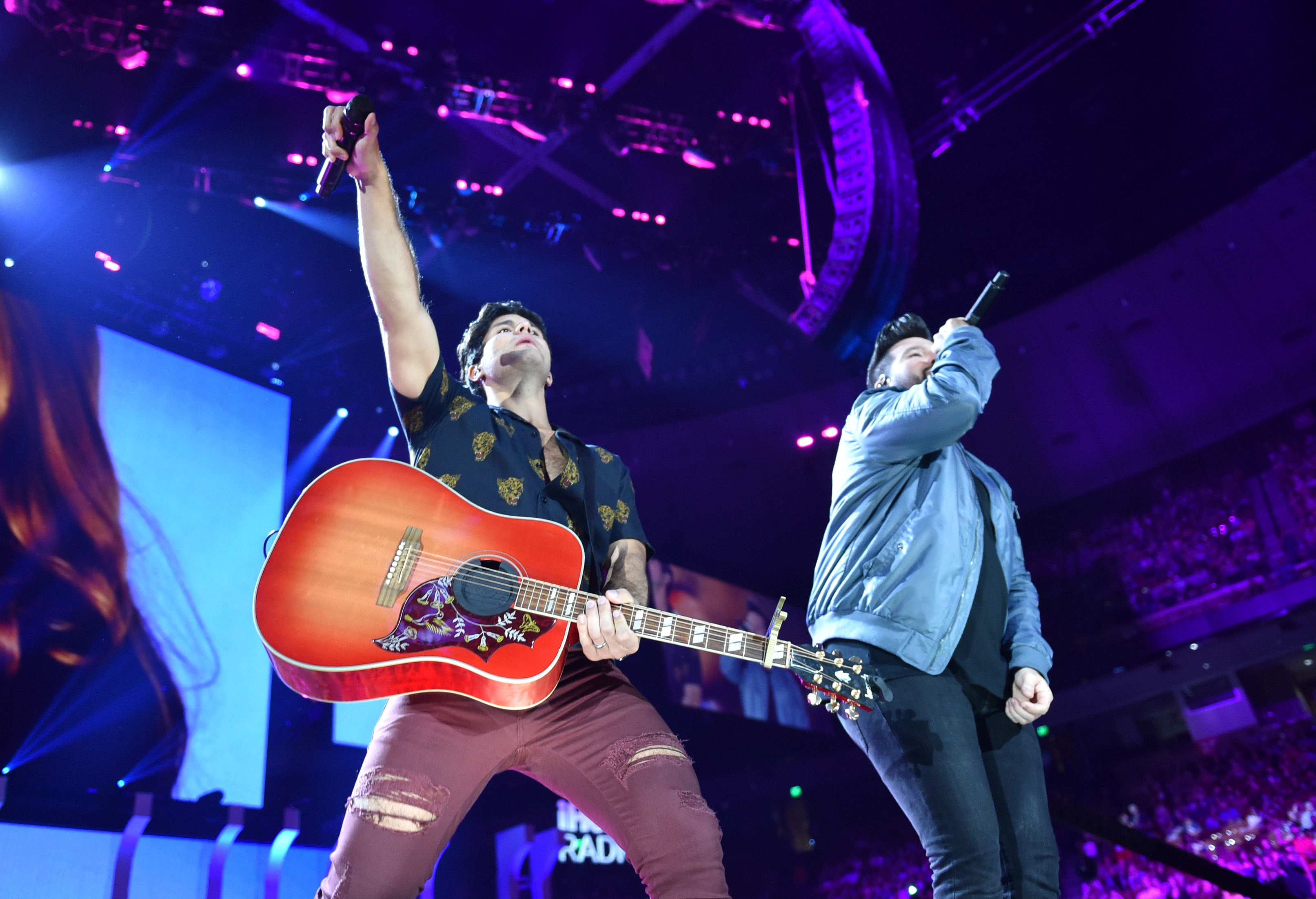 AUSTIN, TX - MAY 05: (EDITORIAL USE ONLY. NO COMMERCIAL USE) Dan Smyers (L) and Shay Mooney of musical group Dan + Shay perform onstage during the 2018 iHeartCountry Festival By AT&T at The Frank Erwin Center on May 5, 2018 in Austin, Texas. 
