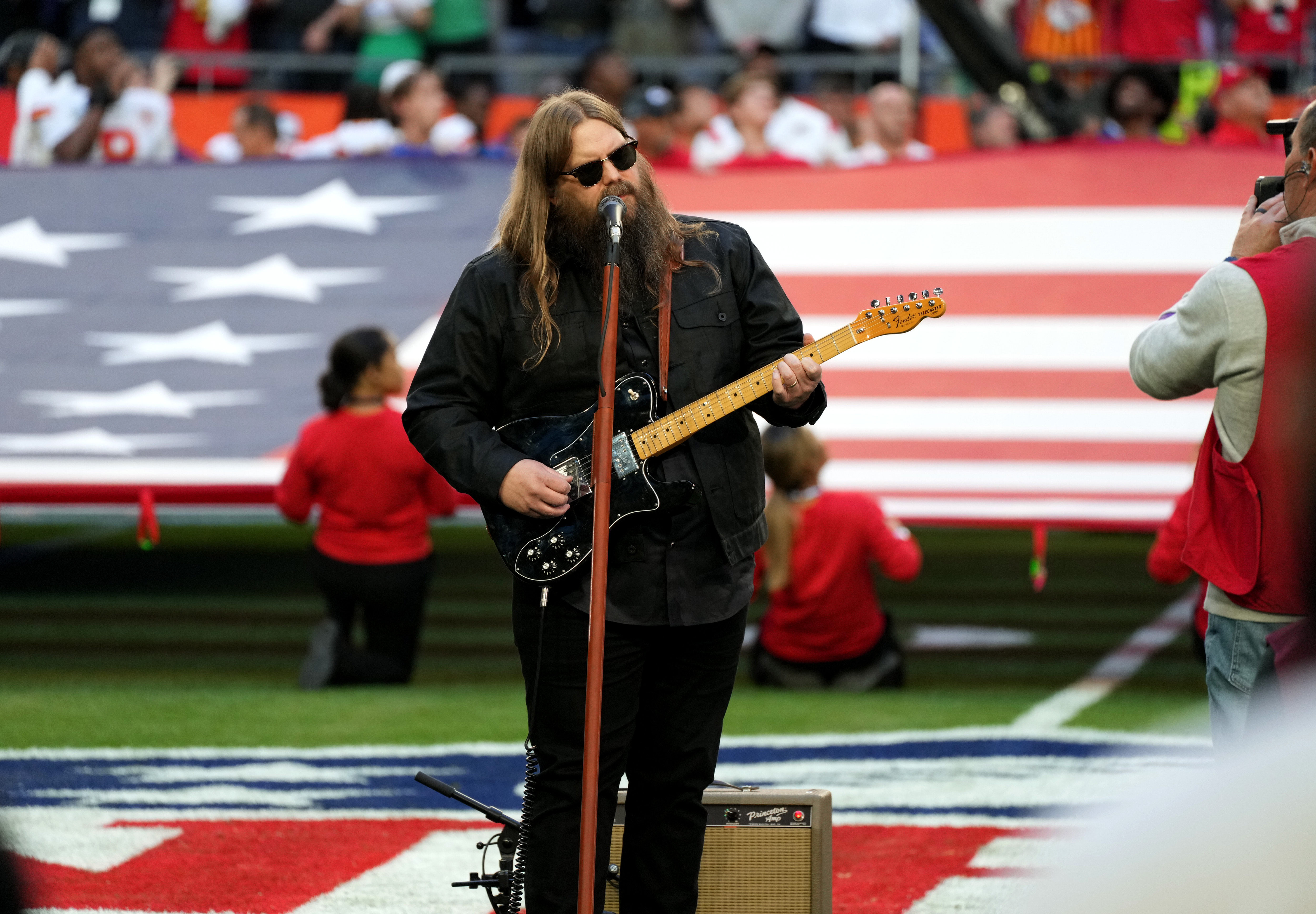 GLENDALE, ARIZONA - FEBRUARY 12: Chris Stapleton performs the national anthem during Super Bowl LVII at State Farm Stadium on February 12, 2023 in Glendale, Arizona.