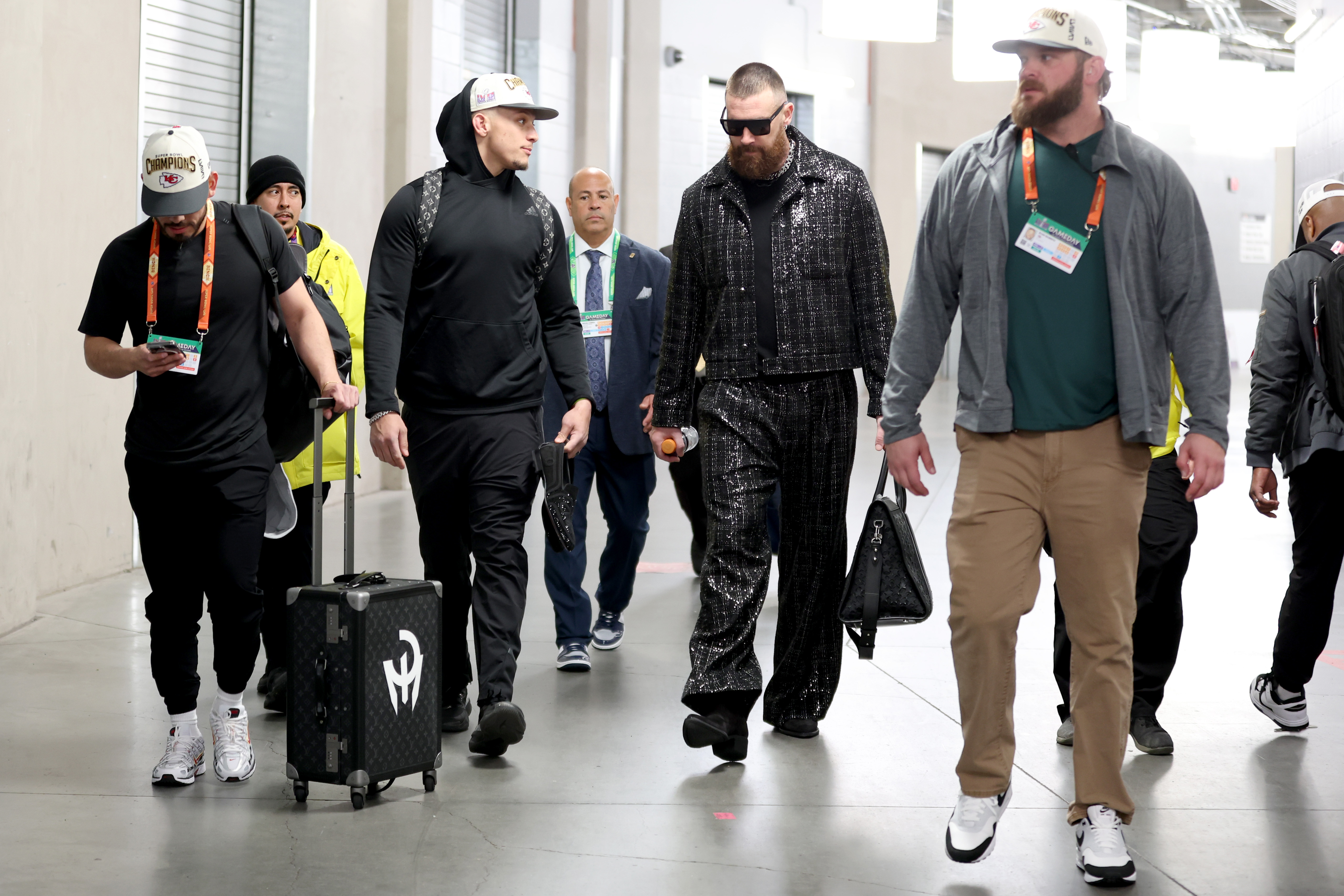 LAS VEGAS, NEVADA - FEBRUARY 11: Patrick Mahomes #15 of the Kansas City Chiefs and Travis Kelce #87 walk through the tunnel as they leave the stadium after defeating the San Francisco 49ers 25-22 in overtime during Super Bowl LVIII at Allegiant Stadium on February 11, 2024 in Las Vegas, Nevada. 
