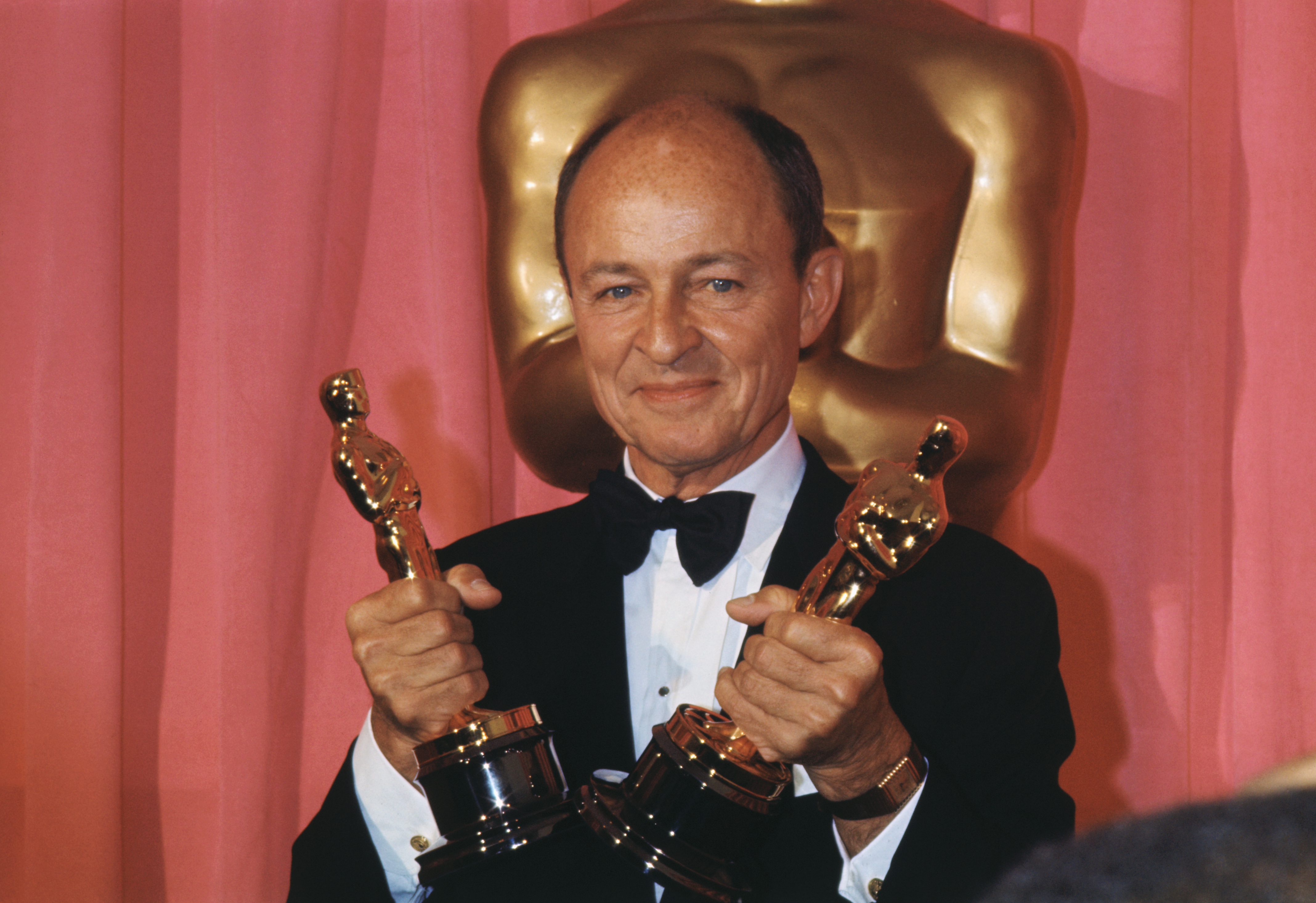 (Original Caption) Los Angeles, California: Producer Frank McCarthy holds two Oscars, one for Patton, which was named best picture and one for the absent George C. Scott, who won best actor in title role of Patton, during Academy Awards Ceremonies here.