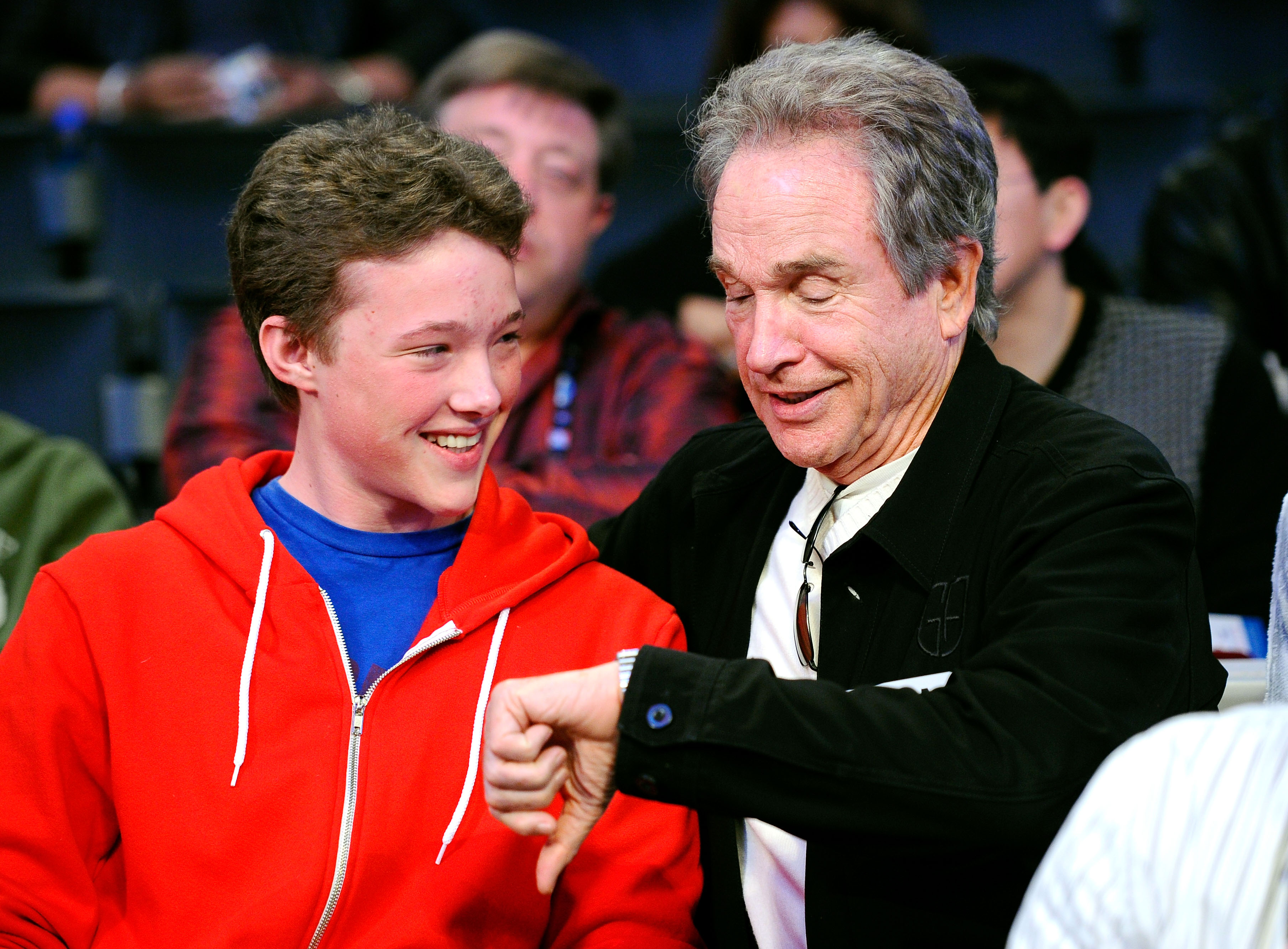 LOS ANGELES, CA - FEBRUARY 20: Actor Warren Beatty (R) and his son Benjamin talk during the 2011 NBA All-Star game at Staples Center on February 20, 2011 in Los Angeles, California.