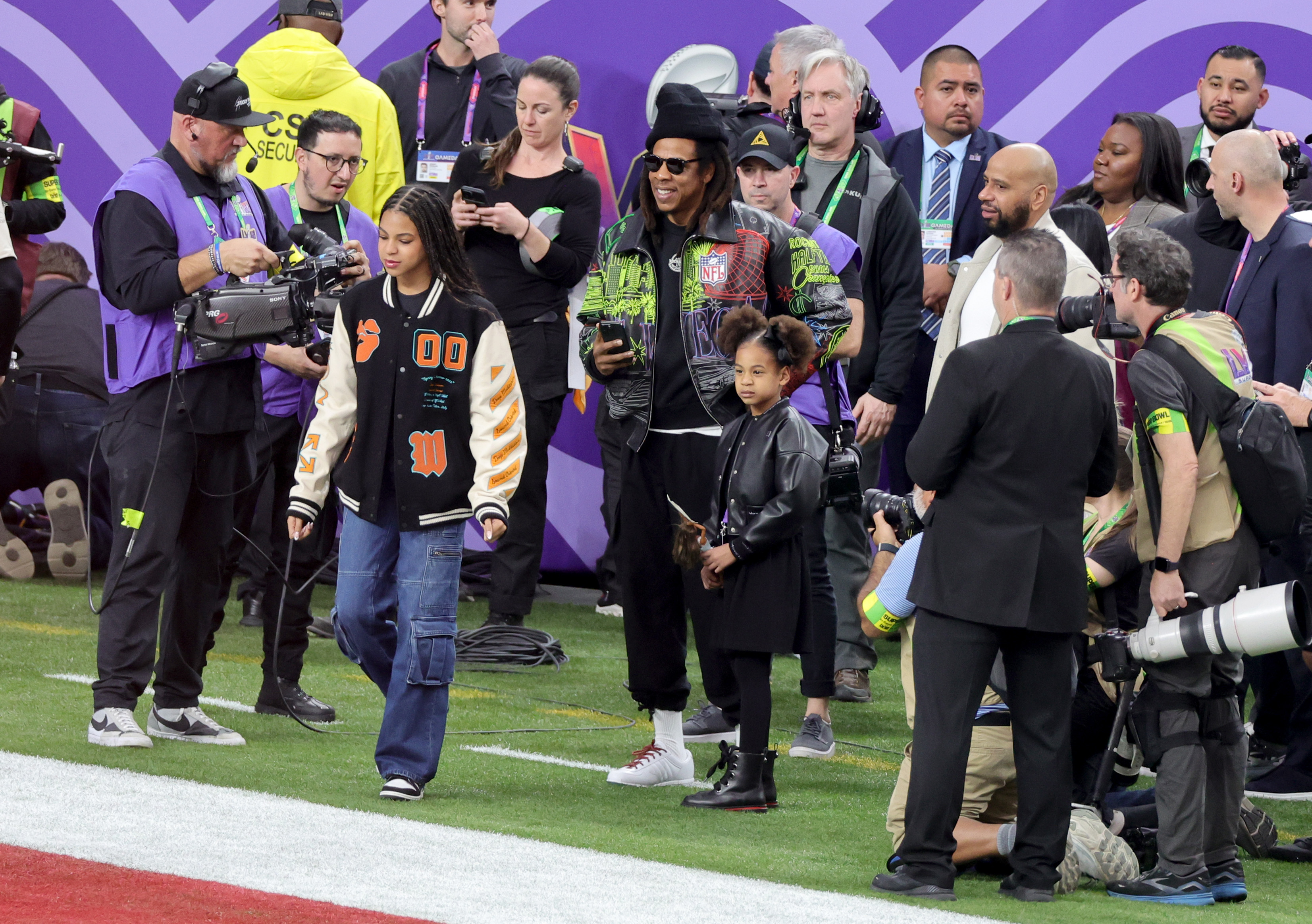 LAS VEGAS, NEVADA - FEBRUARY 11: (L-R) Blue Ivy Carter, Jay-Z and Rumi Carter are seen prior to Super Bowl LVIII at Allegiant Stadium on February 11, 2024 in Las Vegas, Nevada. 