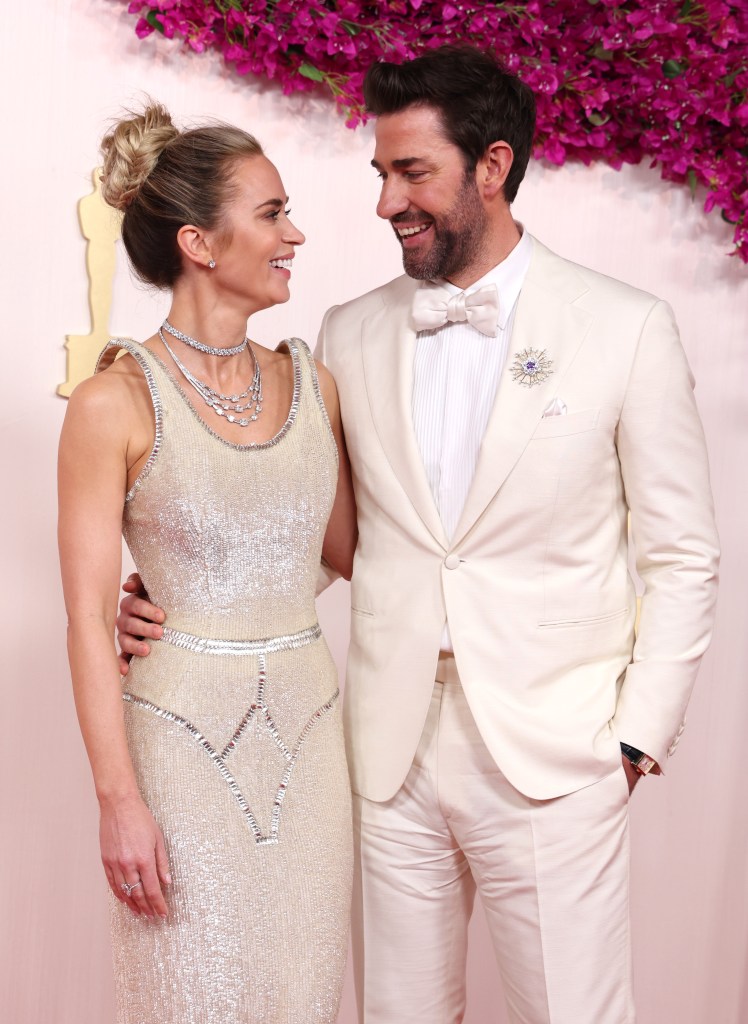 HOLLYWOOD, CALIFORNIA - MARCH 10: (L-R) Emily Blunt and John Krasinski attends the 96th Annual Academy Awards on March 10, 2024 in Hollywood, California.