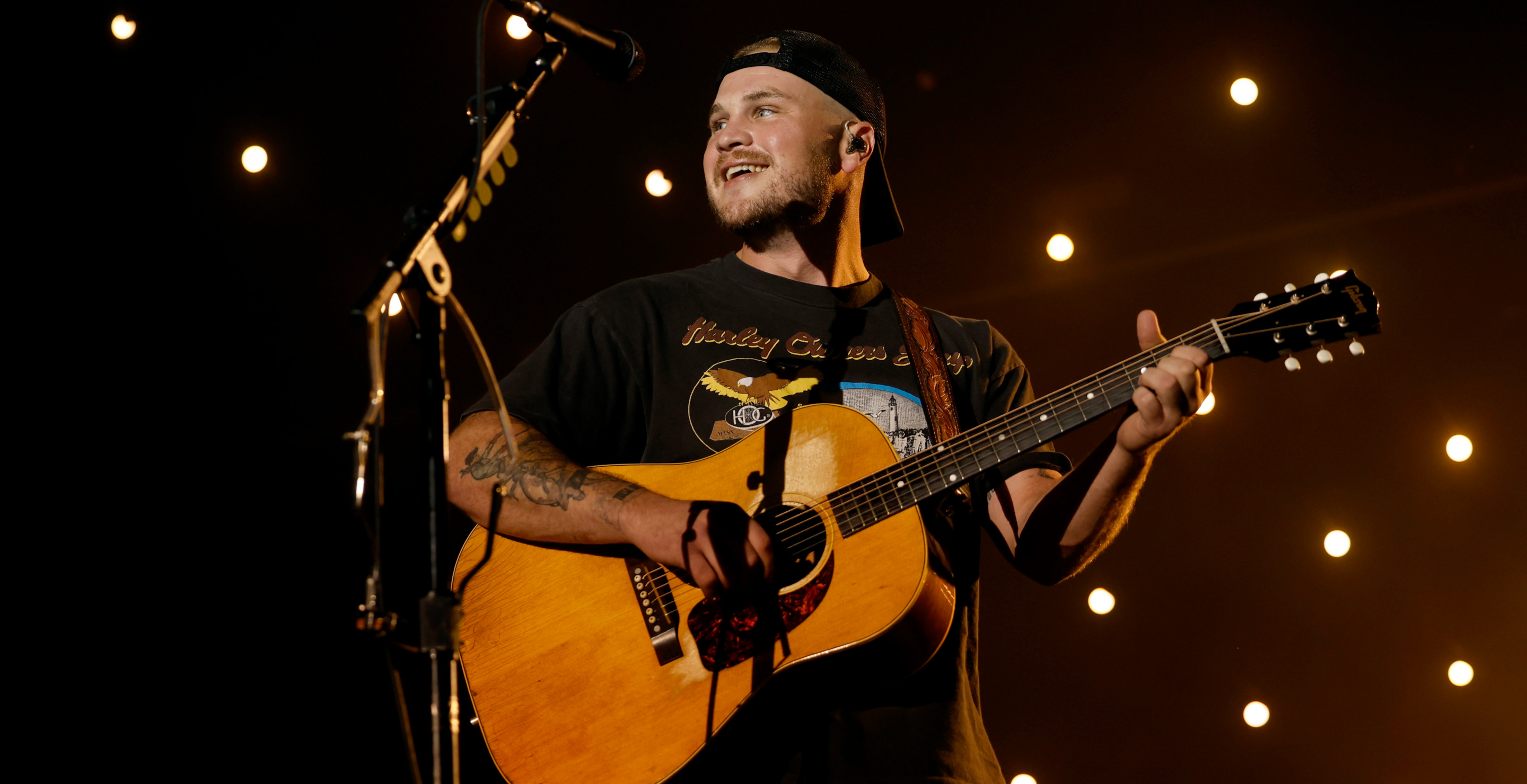 One Zach Bryan Fan Sacrificed His T-Shirt For Chance to Duet With Country Singer in Viral Moment