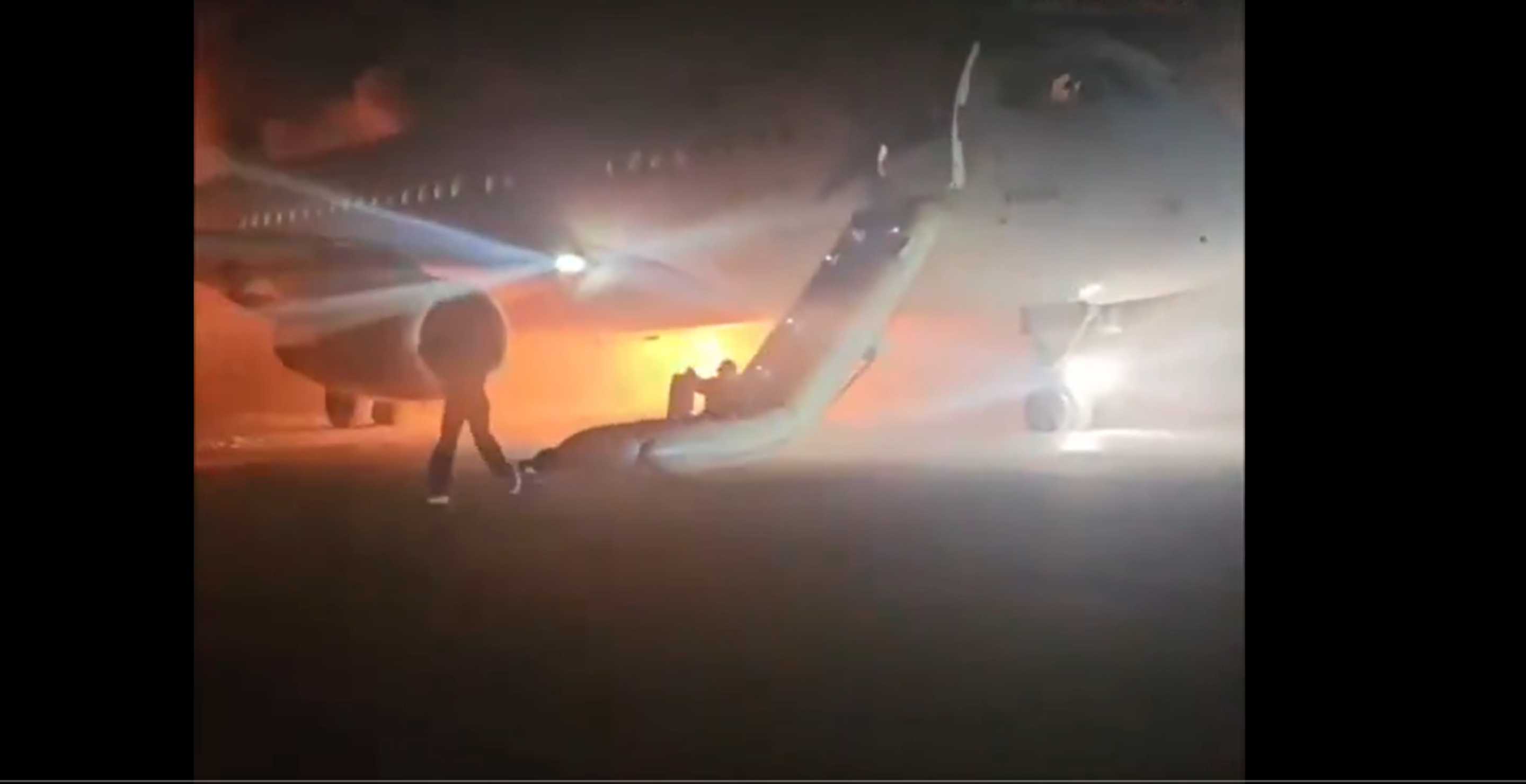 Terrifying Moment Families With Young Children Forced To Flee Burning Plane