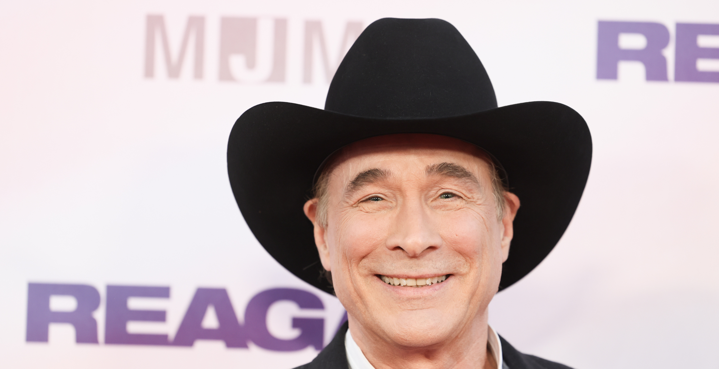 clint black debuts cover of take me home country roads for reagan film