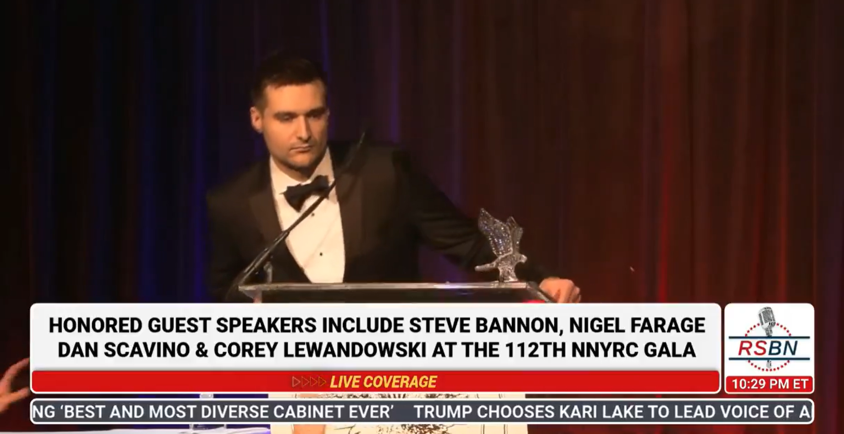Trump Advisor Alex Bruesewitz Collapses on Stage During Speech Video