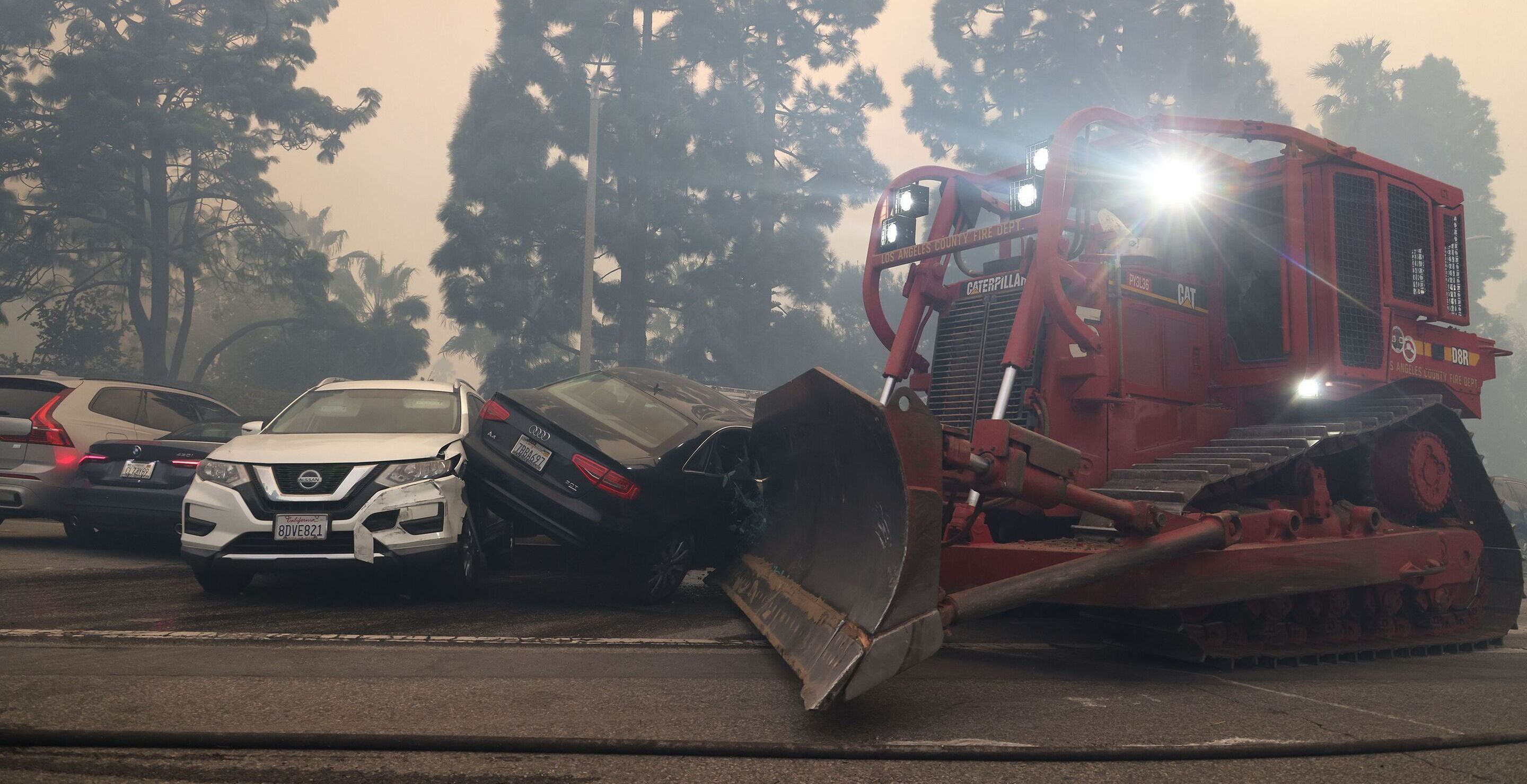 Bulldozers Used To Move Abandoned Cars As People Flee Wildfire