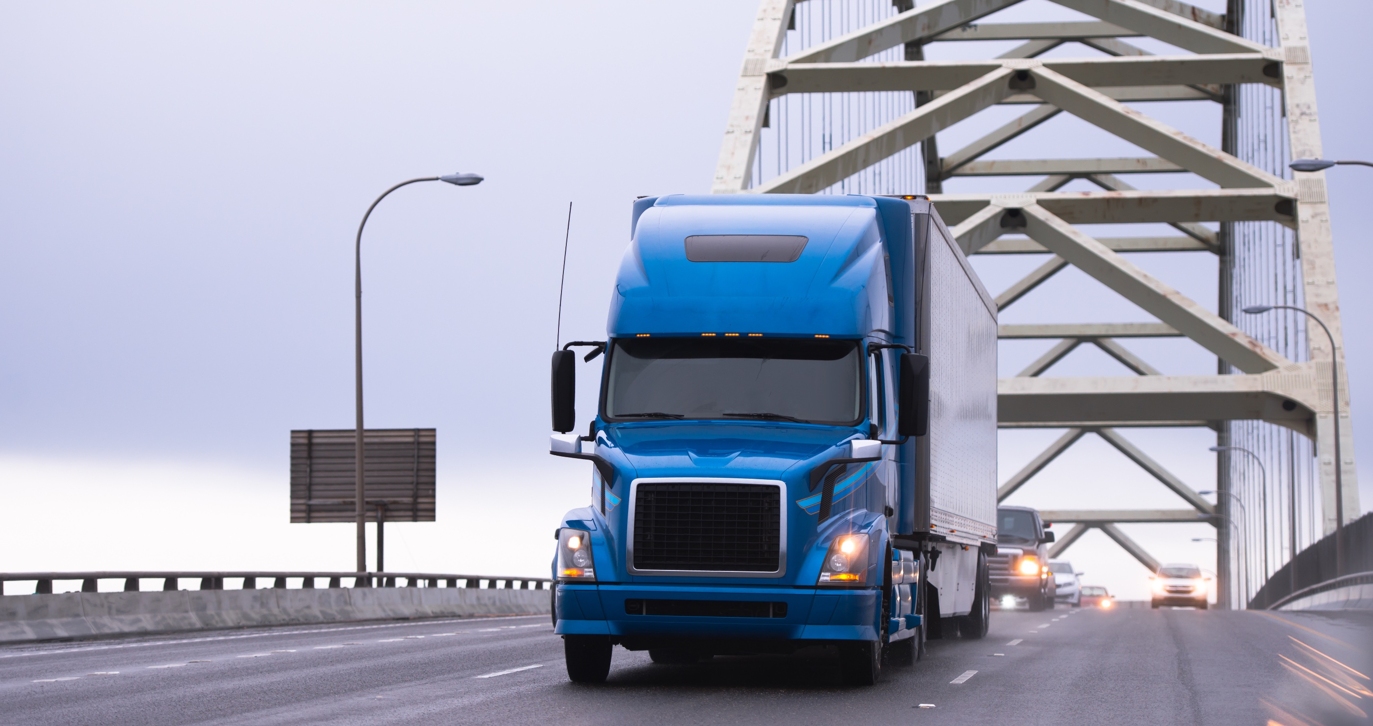 man jumps off bridge to avoid oncoming truck