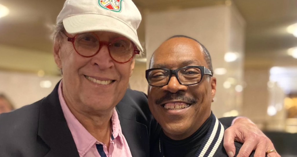 Chevy Chase and Eddie Murphy pose for a photo together at Chris Rock birthday bash 