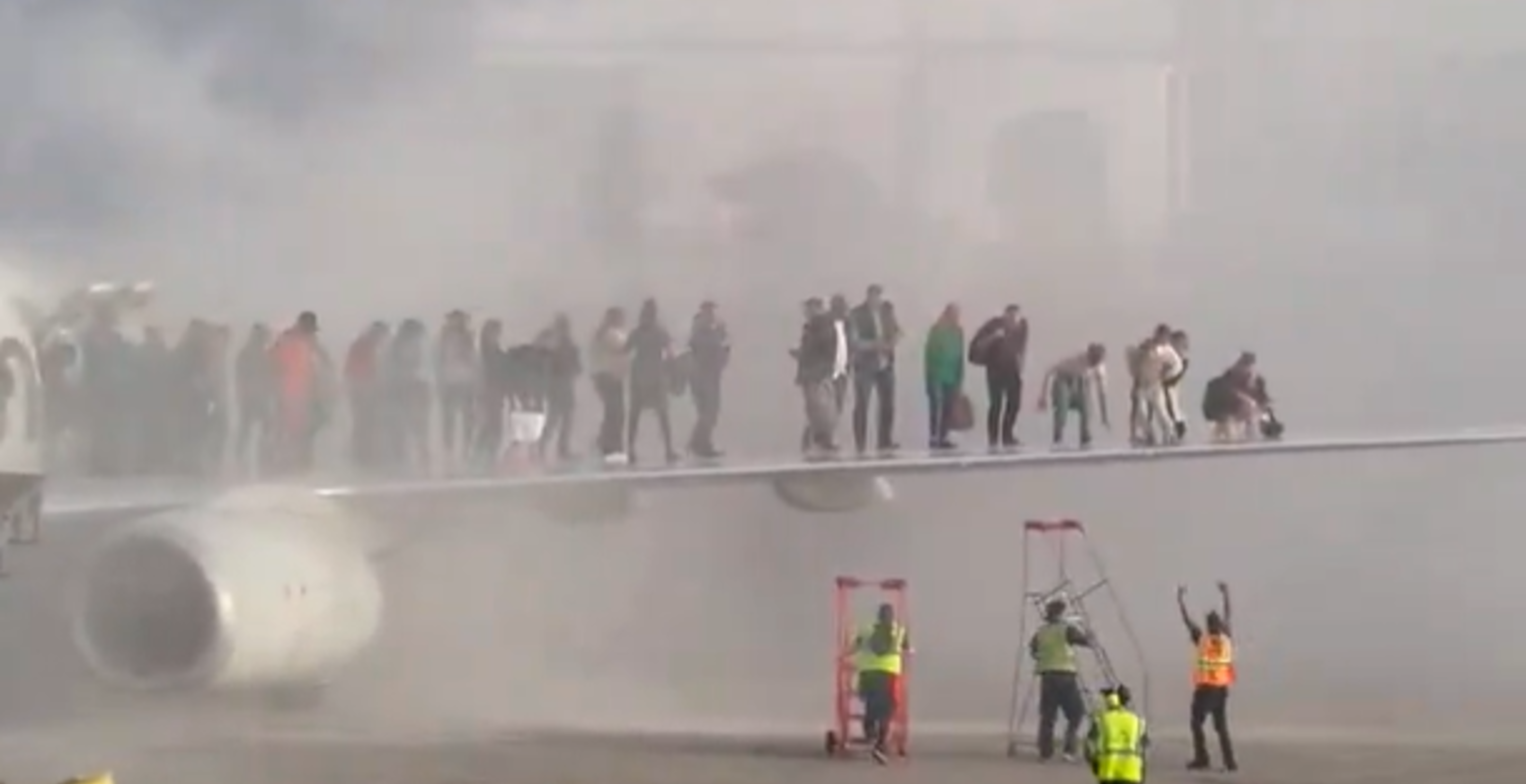 Passengers Forced To Climb Onto Plane’s Wing After American Airlines Flight Catches Fire