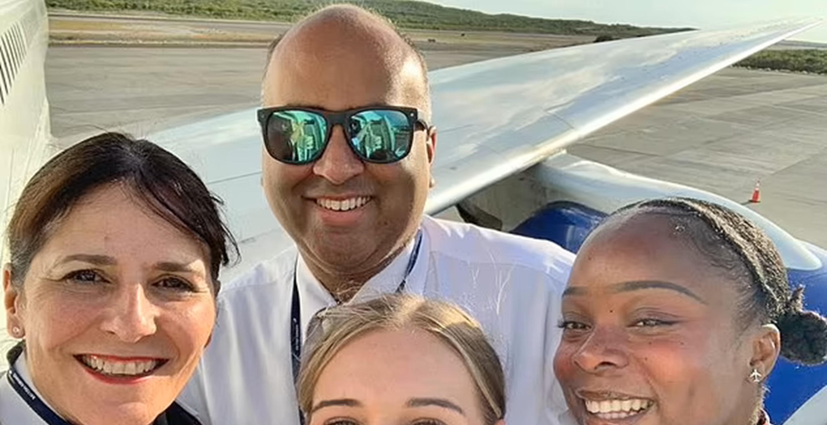 British Airways flight attendant Irfan Ali Mirza, 45, back row, was found dead in a U.S. hotel room.