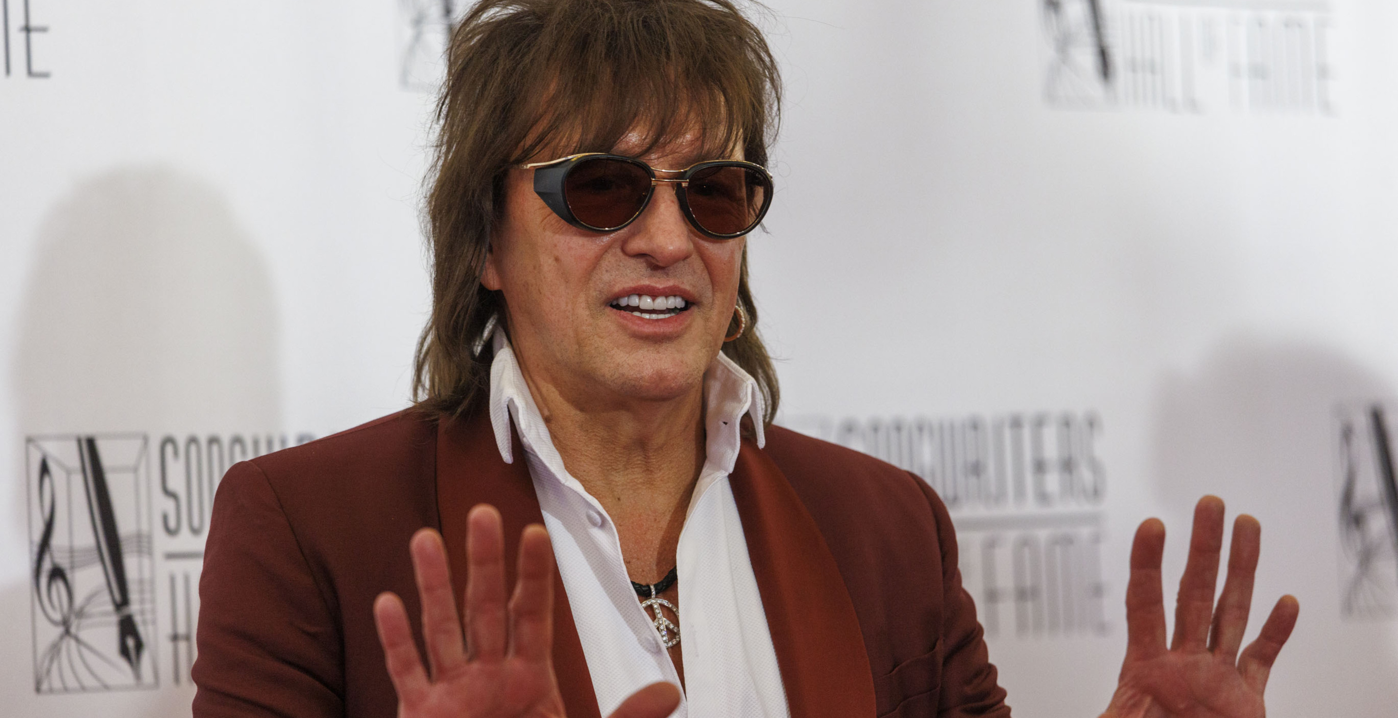 Rock Star Rocks Out Despite Breaking Hand While Playing Touch Football