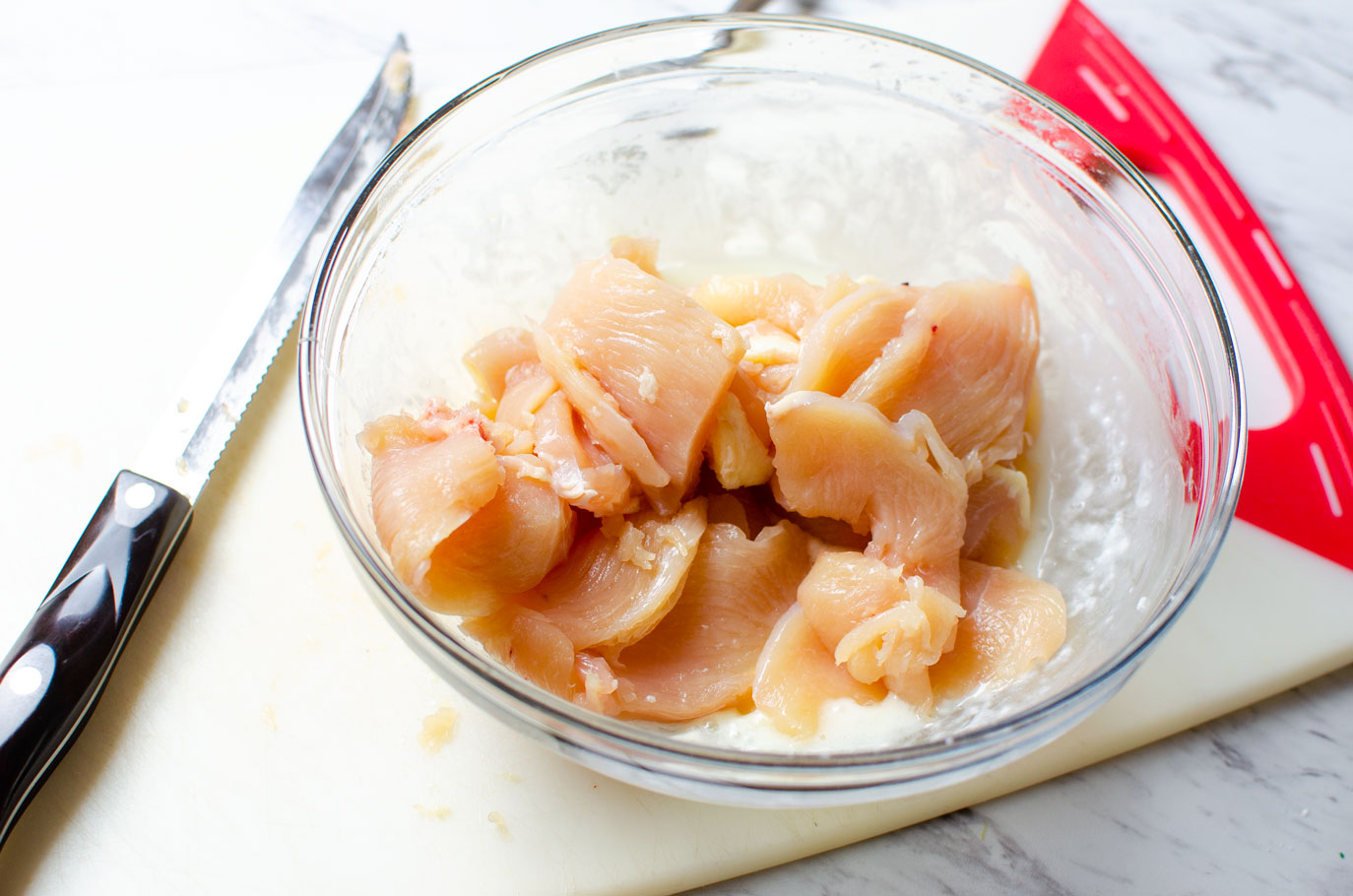 Cut chicken in a bowl