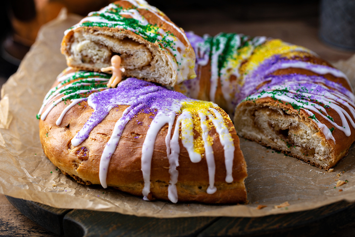 King cake for Mardi Gras, New Orlean traditional pastry with a plastic baby