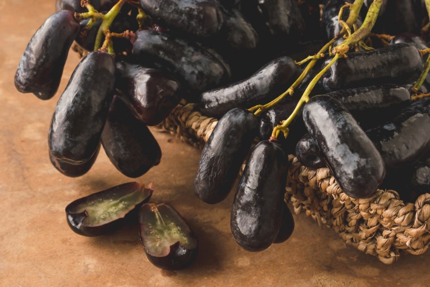 Black seedless moon drops grape or Witch fingers grape in basket