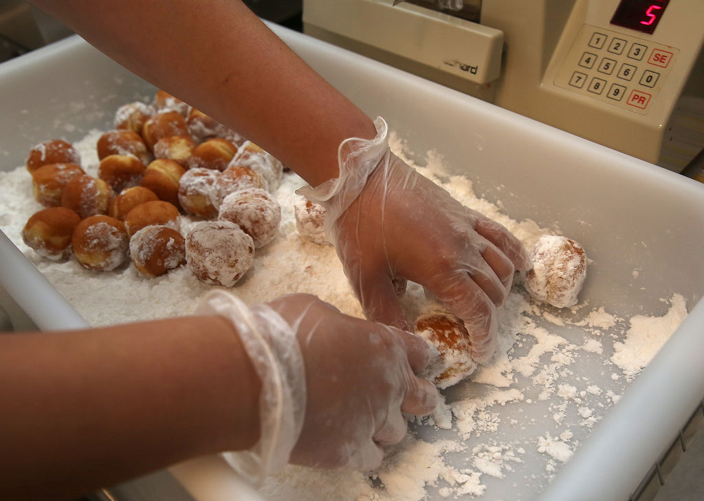 Donut baker Willy Vassallo shows how he makes custard filled munchkins at Dunkin' Donuts on Monday, June 20, 2016, in Walnut Creek, Calif..   The Bay Area's very first Dunkin' Donuts shop is opening on Wednesday.