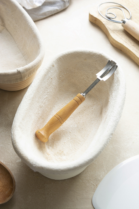 Rattan banneton, proofing basket for sourdough bread. Baking utensile. Basic set of baking bread home