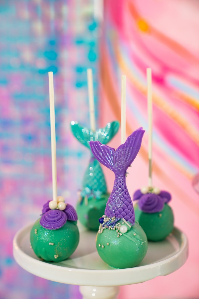 cake pops in a nautical style with a candle number five. 