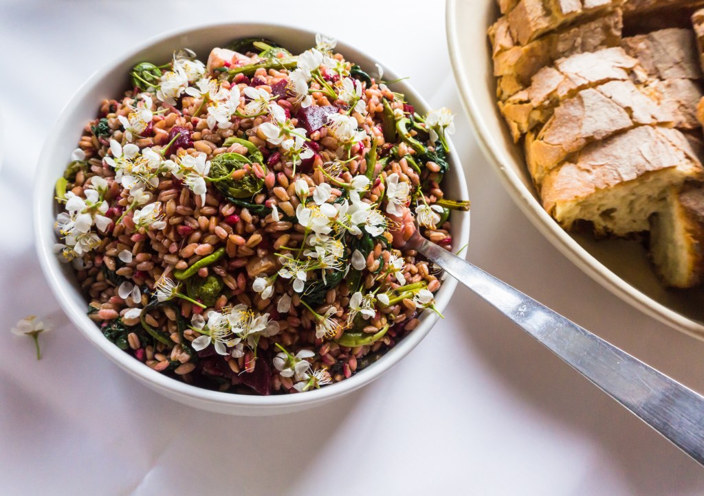 healthy grain salad made with farro, beets,