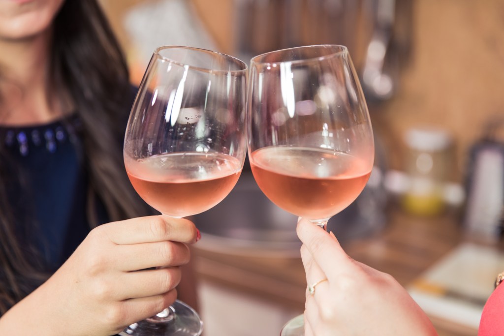 toasting with rose wine 