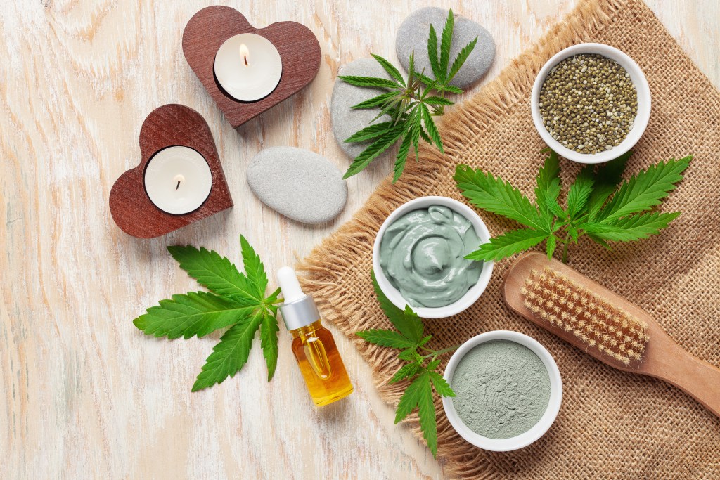 Homemade face mask made of clay with cannabis seeds. Kosmetik concept. Top view. Flat lay