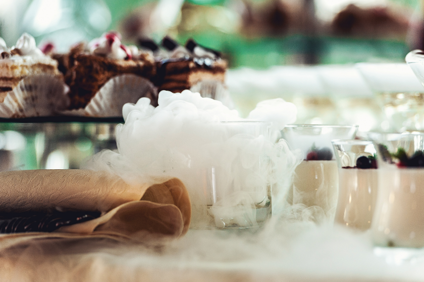 smoked cocktails lined up at party setup