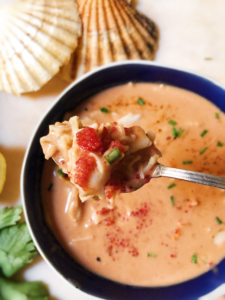 She crab soup in spoon