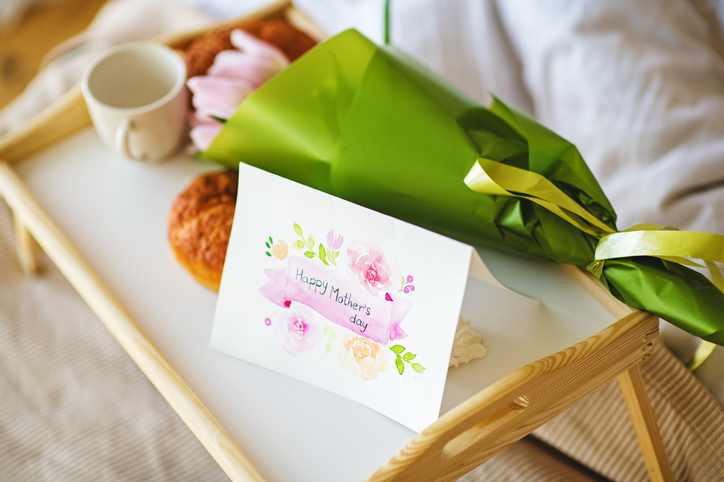 Handmade greeting card and tulips. Breakfast in bed for Mother's Day