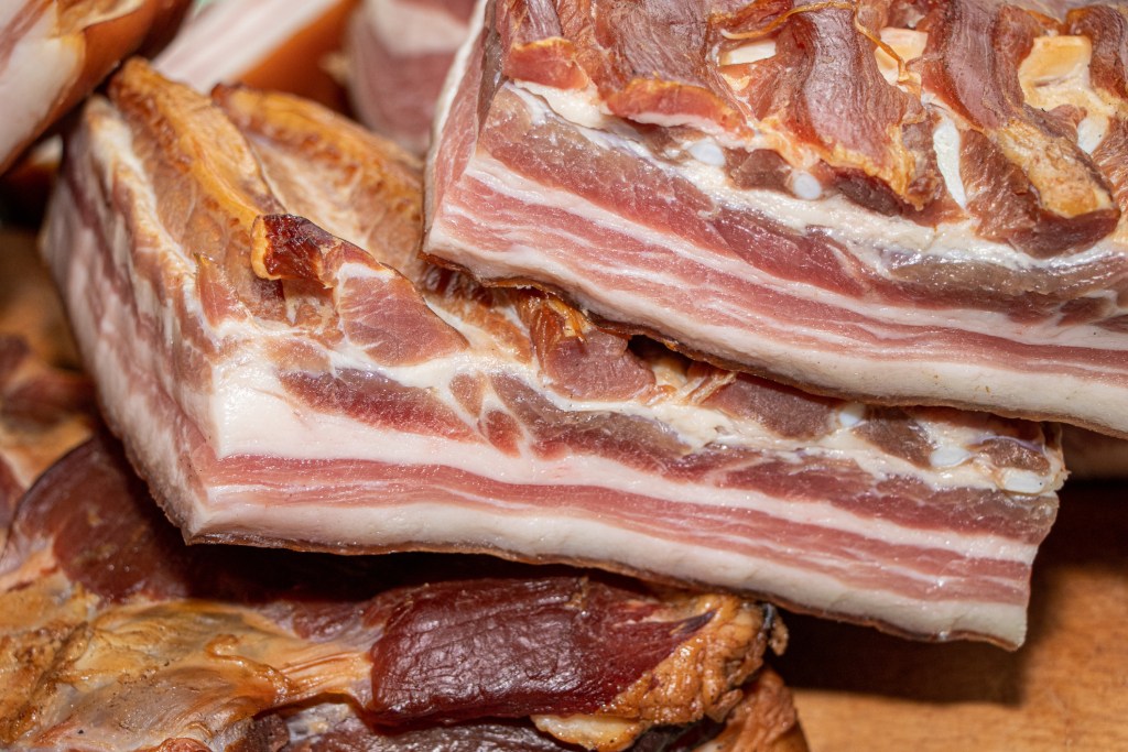 Smoked pork bacon on a wooden board