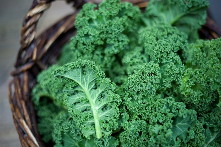 Kale in rustic basket on daylight close Up