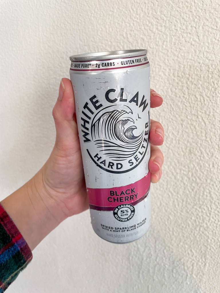 Black Cherry White Claw in hand