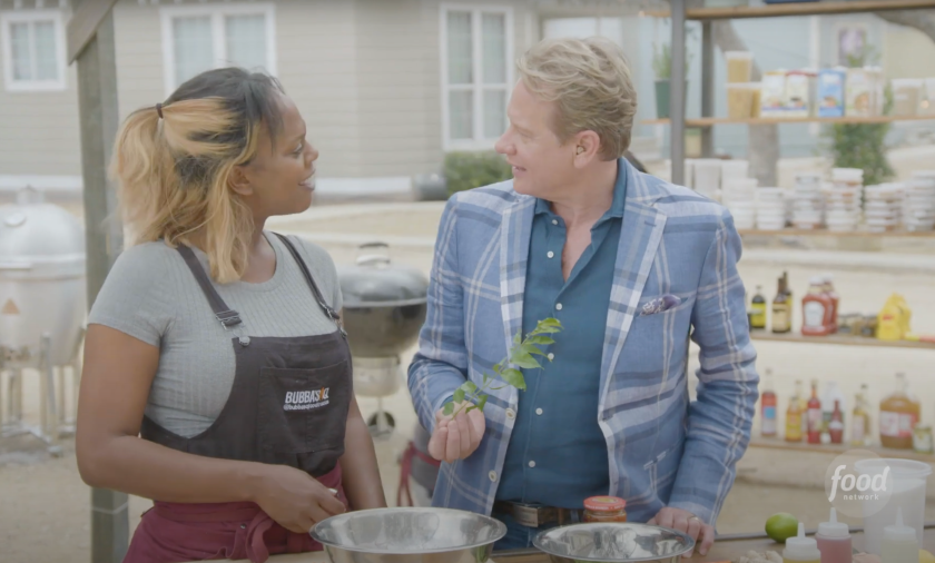 Carson Kressley and a contestant of BBQ brawl
